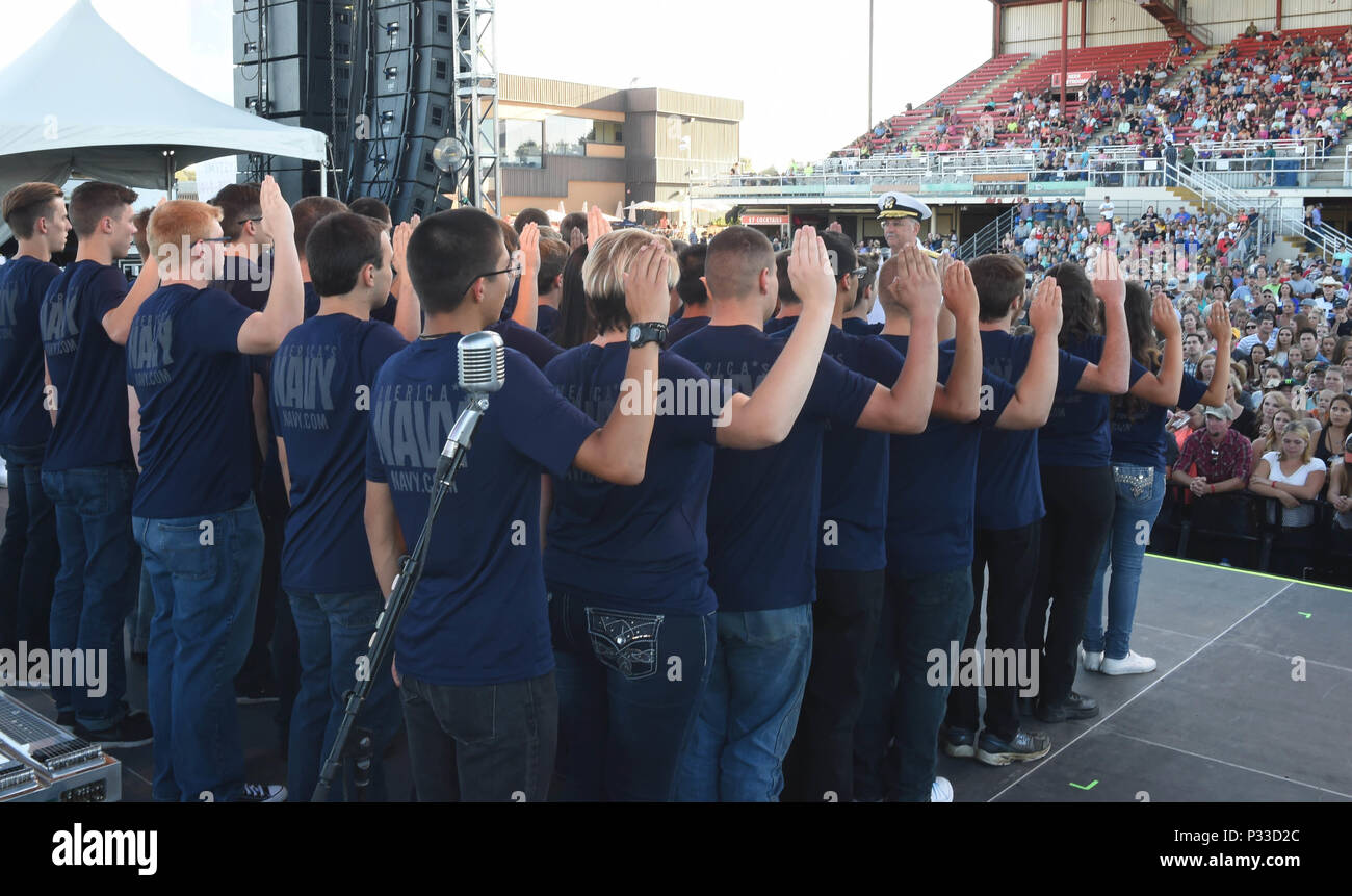BOISE, Idaho (August 23, 2016) Rear Adm. Bruce Gillingham, Commander, Navy Medicine West administers the oath of enlistment to 40 Delayed Entry Program members from Naval Recruiting District Portland during the Western Idaho Fair as part of Boise Navy Week. Navy Weeks focus a variety of outreach assets, equipment and personnel on a single city for a weeklong series of engagements with key influencers andorganizations. (US Navy Photo by Mass Communication Specialist 1stClass Marie A. Montez) Released Stock Photo