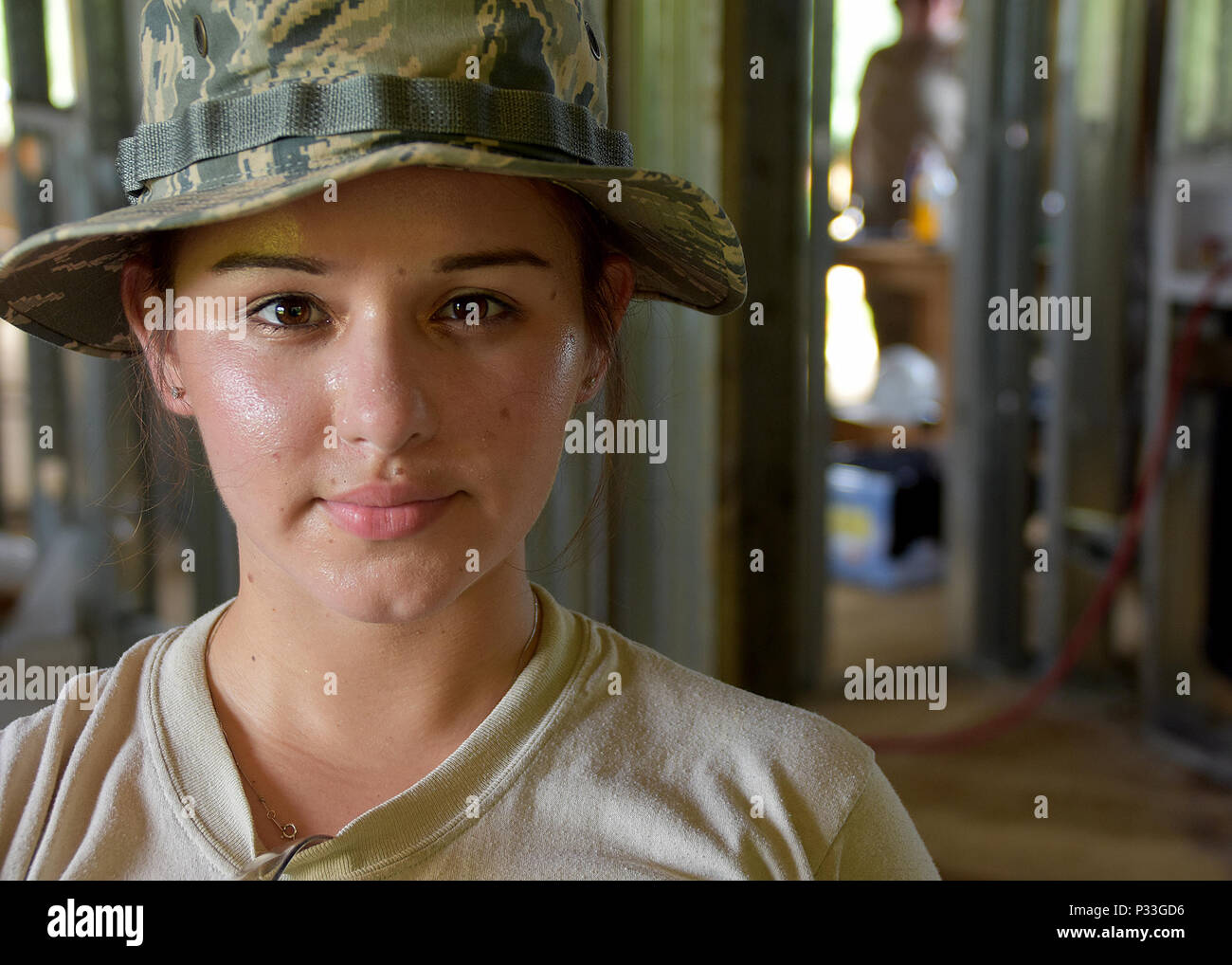 Staff Sgt. Catherine Solano from the 143d Civil Engineering Squadron (CES),  Rhode Island Air National Guard provides cement skim coating to strengthen  walls for extreme weather conditions in Inarajan, Guam during an