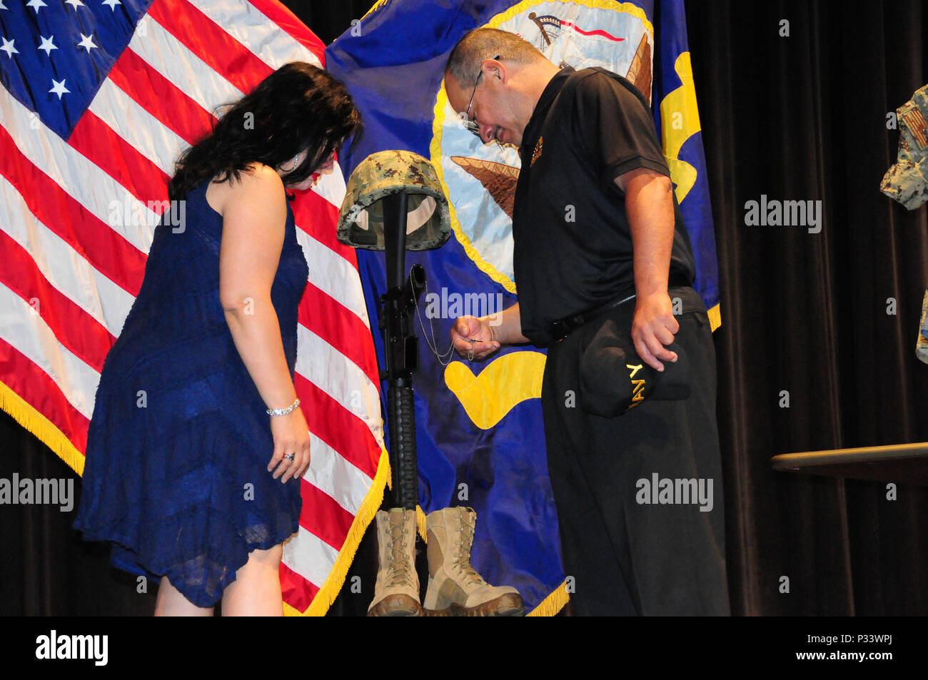 160827-N-XB816-076 FORT WORTH, Texas (August 27, 2016) Rick Zamarripa (right) and Valerie Zamarripa, parents of Master-at-Arms 1st Class Patrick Zamarripa, pay their respects to their son at Naval Air Station Fort Worth Joint Reserve Base.  Zamarripa was one of the five police officers killed July 7 by a lone gunman during a protest in Dallas. (U.S. Navy photo by Mass Communication Specialist 2nd Class Jason Howard/Released) Stock Photo