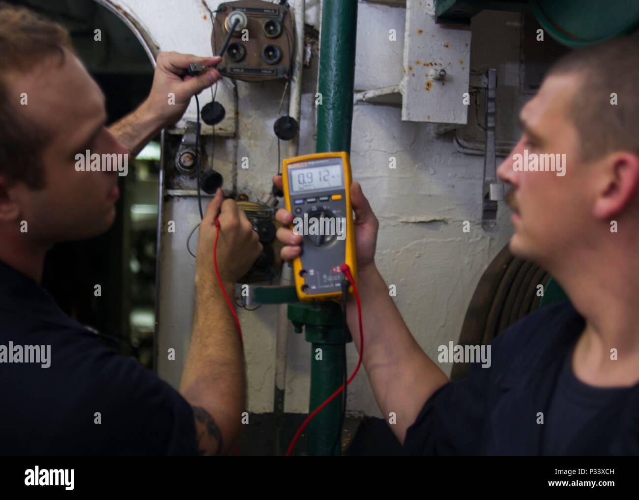 160829-N-RG522-055 ATLANTIC OCEAN (Aug. 29, 2016) Interior Communications Electrician 3rd Class Jason Goodpaster, left, from Lawrenceburg, Kentucky,  and Interior Communications Electrician Seaman Christopher Bane, from Minneapolis, Minnesota, perform preventative maintenance on sound-powered phone systems aboard the aircraft carrier USS George Washington (CVN 73). George Washington, homeported in Norfolk, is underway conducting carrier qualifications in the Atlantic Ocean.  (U.S. Navy photo by Mass Communication Specialist 3rd Class Jonathan Price) Stock Photo