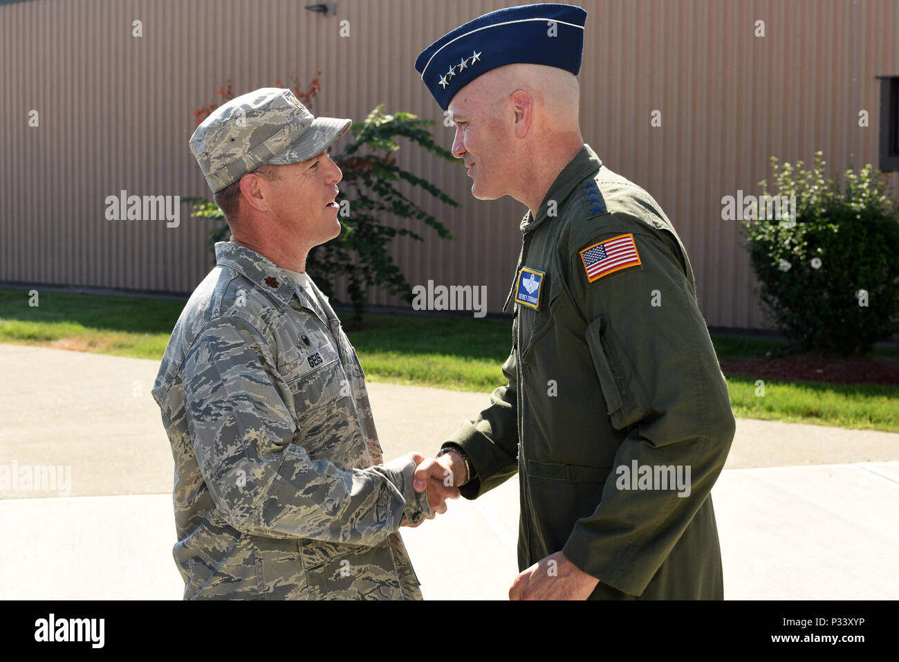 Gen. Carlton D. Everhart II, commander of Air Mobility Command, greets Maj. Geiss at Stewart Air National Guard Base during a visit with Airmen from the 105th Airlift Wing August 13, 2016. Everhart toured the different facilities at the base and met with Airmen of all ranks. (U.S. Air Force National Guard photo by Tech Sgt. Lee Guagenti) Stock Photo
