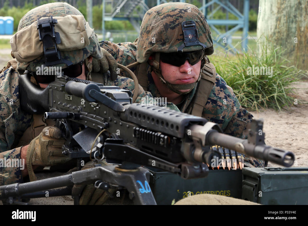 Lance Cpl. Marc Arrigo prepares to fire the M-240 Bravo as Lance Cpl ...