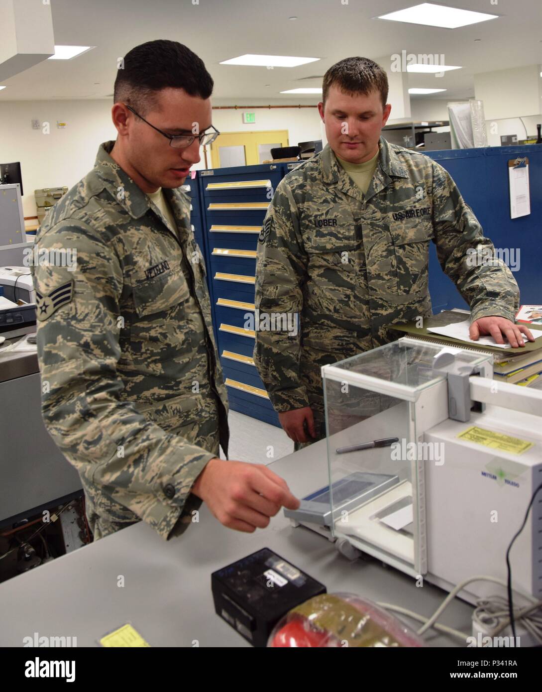 Senior Airmen Eric Vetelino (left) and Staff Sgt. Jacob Lober (right