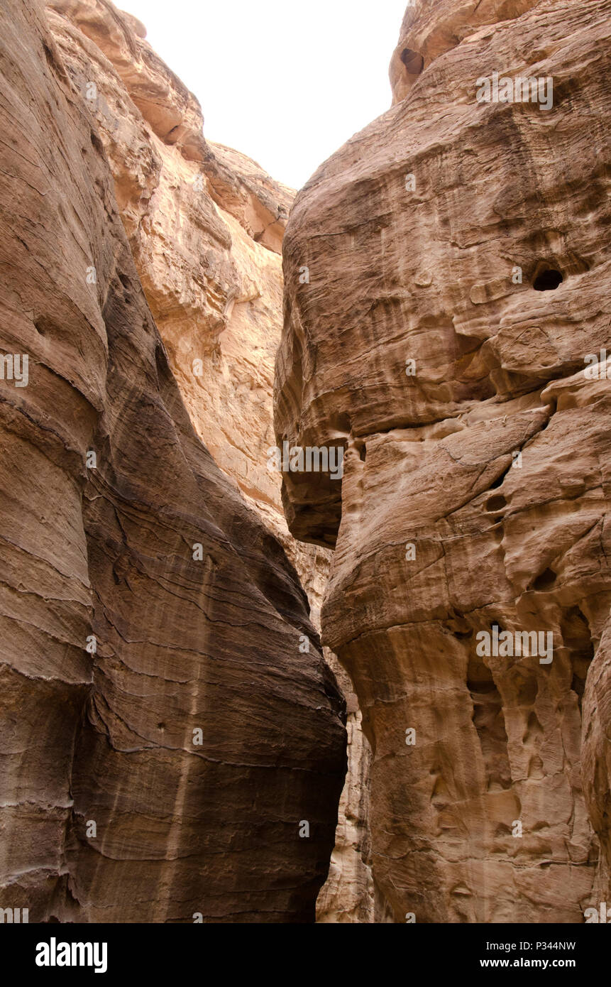 Tall narrow Siq canyon entrance to Petra, Jordan, Middle East Stock Photo