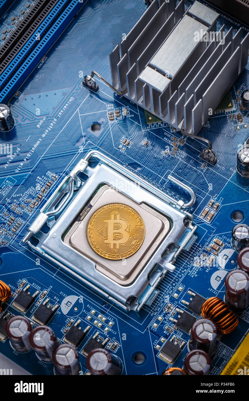 Bitcoin concept - Printed circuit board with bitcoin processor and microchips Stock Photo