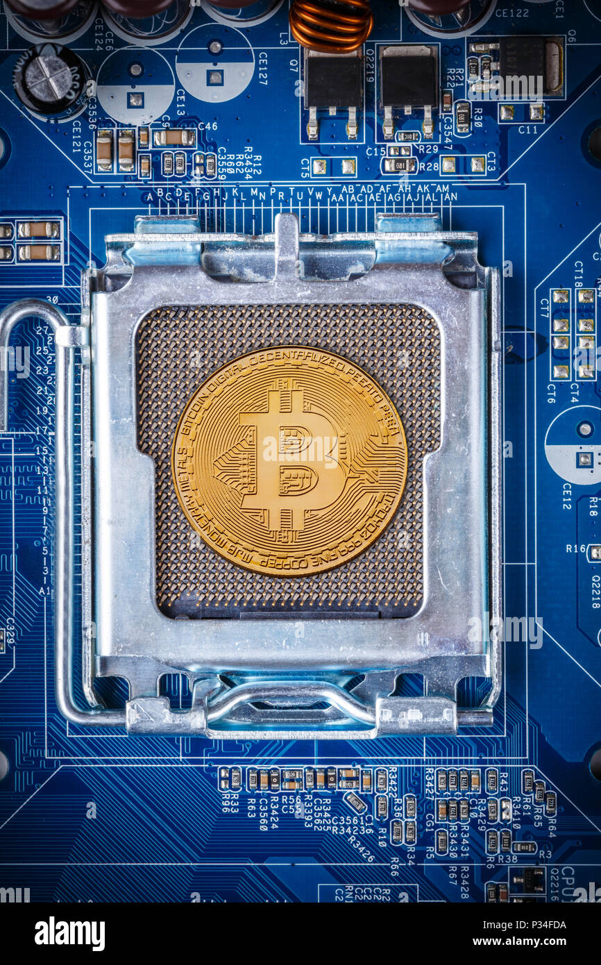 Bitcoin concept - Printed circuit board with bitcoin processor and microchips Stock Photo