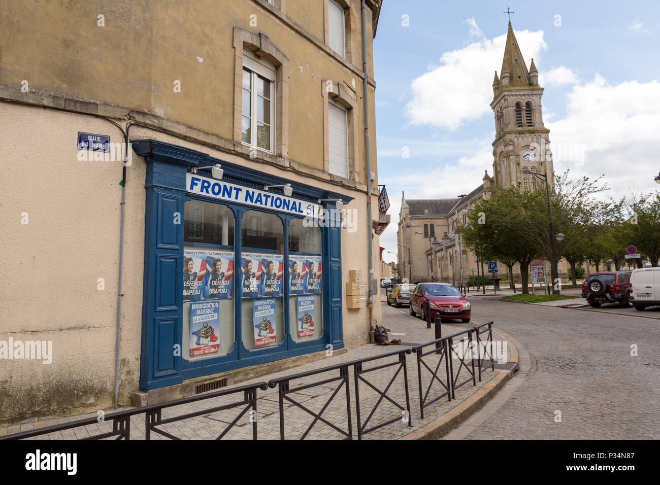 FRANCE, NORMANDY, ALENCON 24-03-2018: Local Rassemblement National office, before know as Front National. With a christian church in the back. Stock Photo