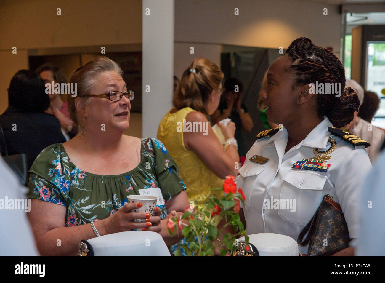 MEMPHIS, Tenn. (June 12, 2018) Lt. Cmdr. Sheree Williams, director, officer programs for Navy Recruiting Command (NRC) speaks with women from the local community at the Women Helping Women breakfast held at the National Civil Rights Museum in Memphis.  The Women Helping Women breakfast, hosted by the Salvation Army- Memphis, is an annual event that focuses on bringing influential women in the area together and what one can do to help out the local community. (U.S. Navy photo by Mass Communication Specialist 3rd Class Abby Rader/Released) Stock Photo