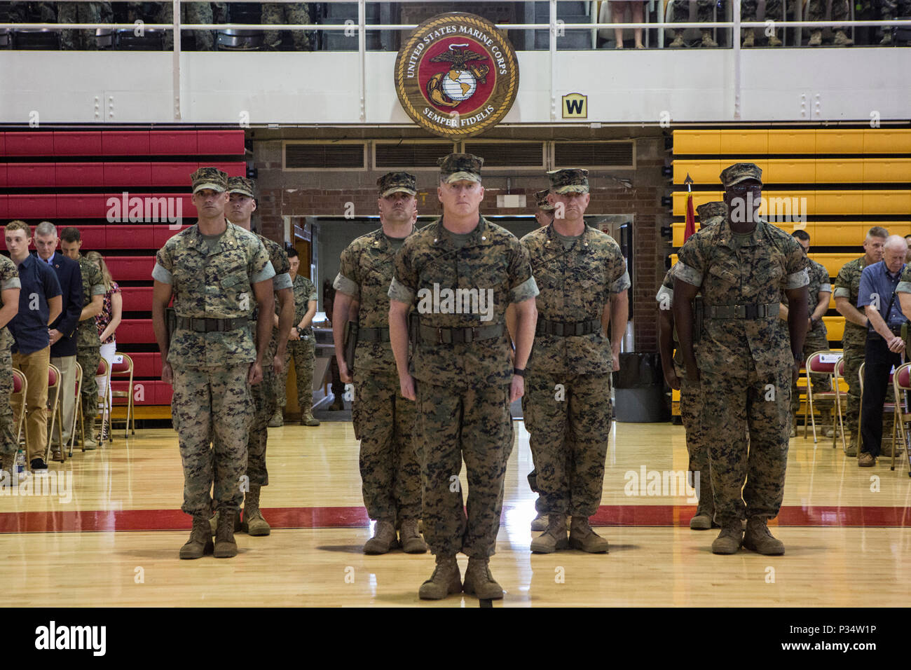 U.S. Marines with 6th Marine Regiment, 2nd Marine Division, stand at attention during a change of command ceremony at Camp Lejeune, N.C., June 12, 2018. During the ceremony, Col. Matthew S. Reid relinquished command of 6th Marine Regiment to Col. Daniel T. Canfield Jr. (U.S. Marine Corps photo by Pfc. Nathaniel Q. Hamilton) Stock Photo