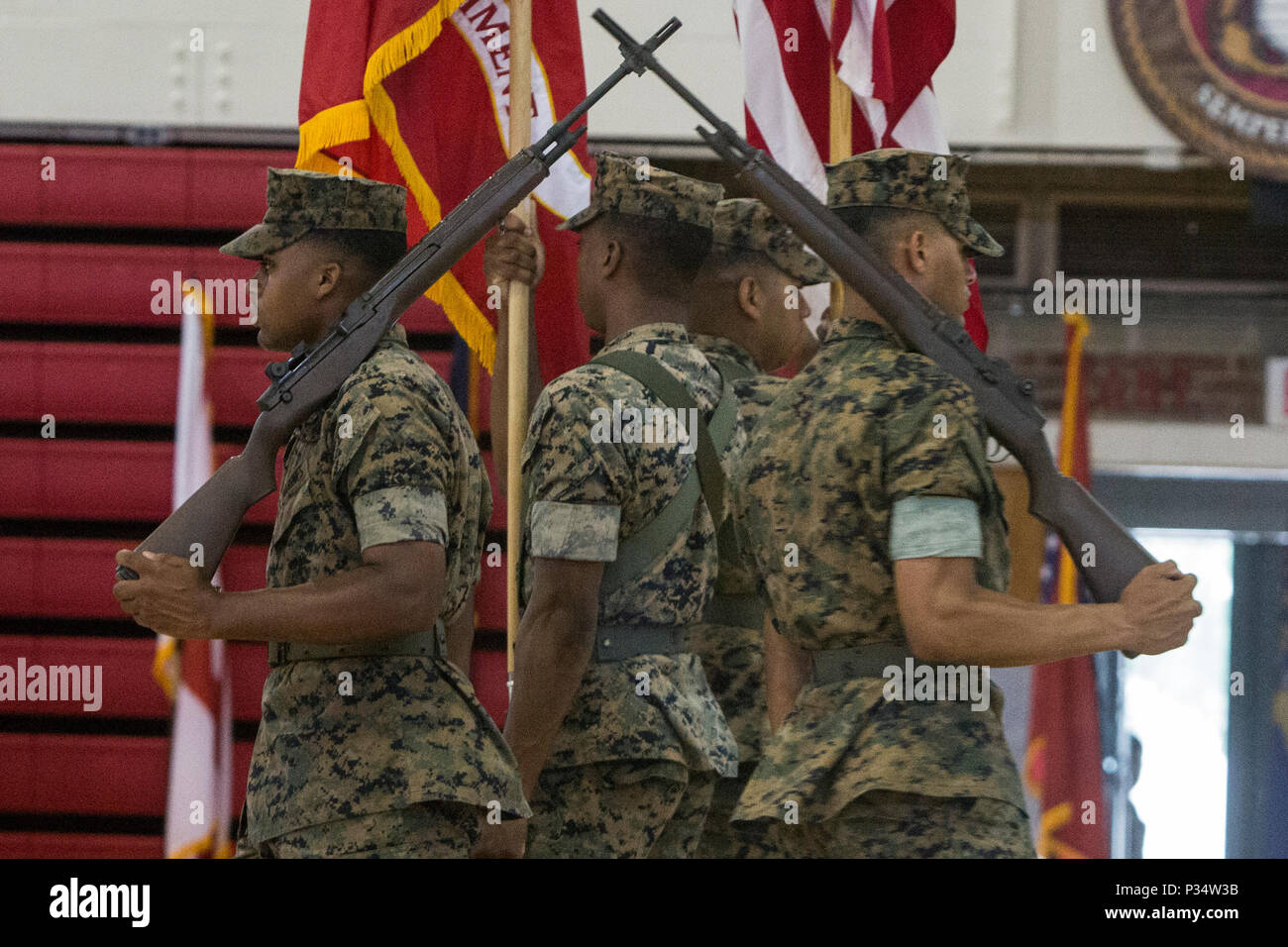 U.S. Marines with 6th Marine Regiment, 2nd Marine Division, march the colors during a change of command ceremony at Camp Lejeune, N.C., June 12, 2018. During the ceremony, Col. Matthew S. Reid relinquished command of 6th Marine Regiment to Col. Daniel T. Canfield Jr. (U.S. Marine Corps photo by Pfc. Nathaniel Q. Hamilton) Stock Photo