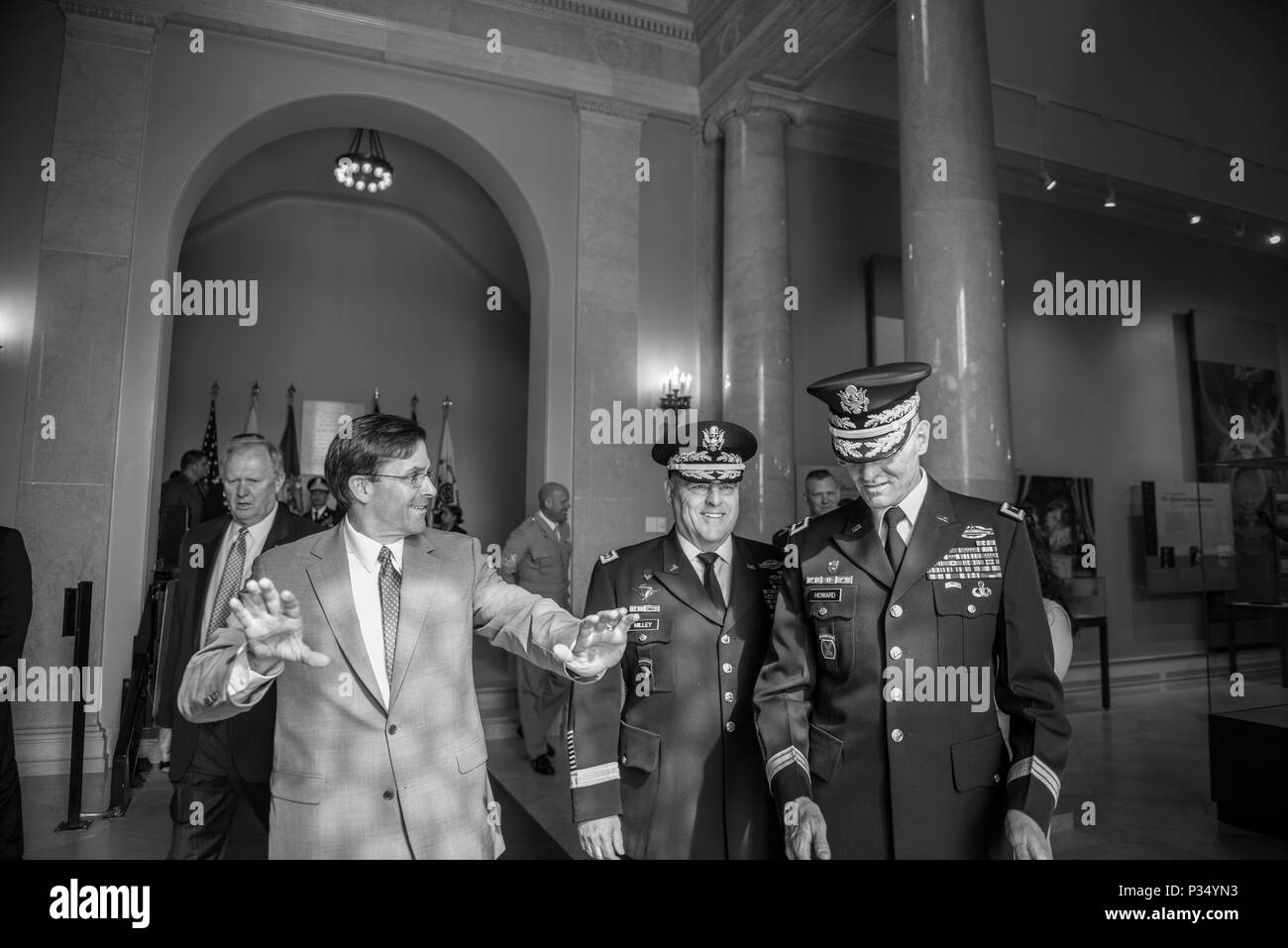 (From the left) Mark T. Esper, secretary, U.S. Army; speaks with Gen. Mark A. Milley, chief of staff, U.S. Army;  and Maj. Gen. Michael Howard, commanding general, U.S. Army Military District of Washington inside of the Memorial Amphitheater Display Room before participating an Army Full Honors Wreath-Laying Ceremony at the Tomb of the Unknown Soldier in honor of the U.S. Army’s 243rd birthday at Arlington National Cemetery, Arlington, Virginia, June 14, 2018. (U.S. Army photo by Elizabeth Fraser / Arlington National Cemetery / released) Stock Photo