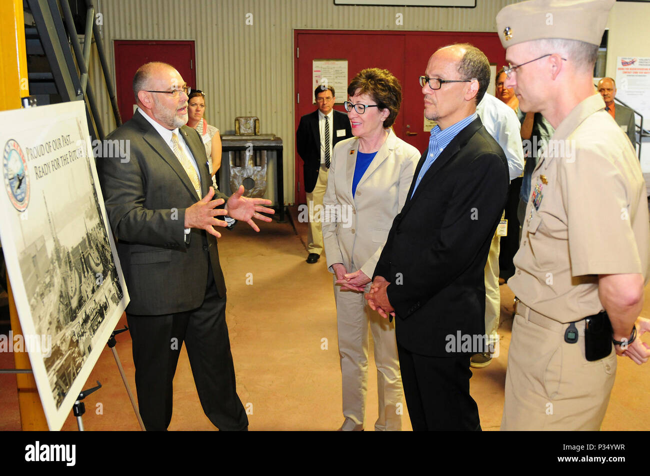 KITTERY, Maine -- 5/27/15 -- Portsmouth Naval Shipyard (PNS) Deputy Public Affairs Officer Gary Hildreth, left, briefs U.S. Senator Susan Collins (R-Maine), U.S. Secretary of Labor, Thomas Perez and PNS Commanding Officer, U.S. Navy Capt Bill Greene at PNS in Kittery on Wednesday.  The delegation visited Bath Iron Works in Bath and Portsmouth Naval Shipyard in Kittery to promote private and public partnerships supporting apprenticeships in the maritime industry. Stock Photo