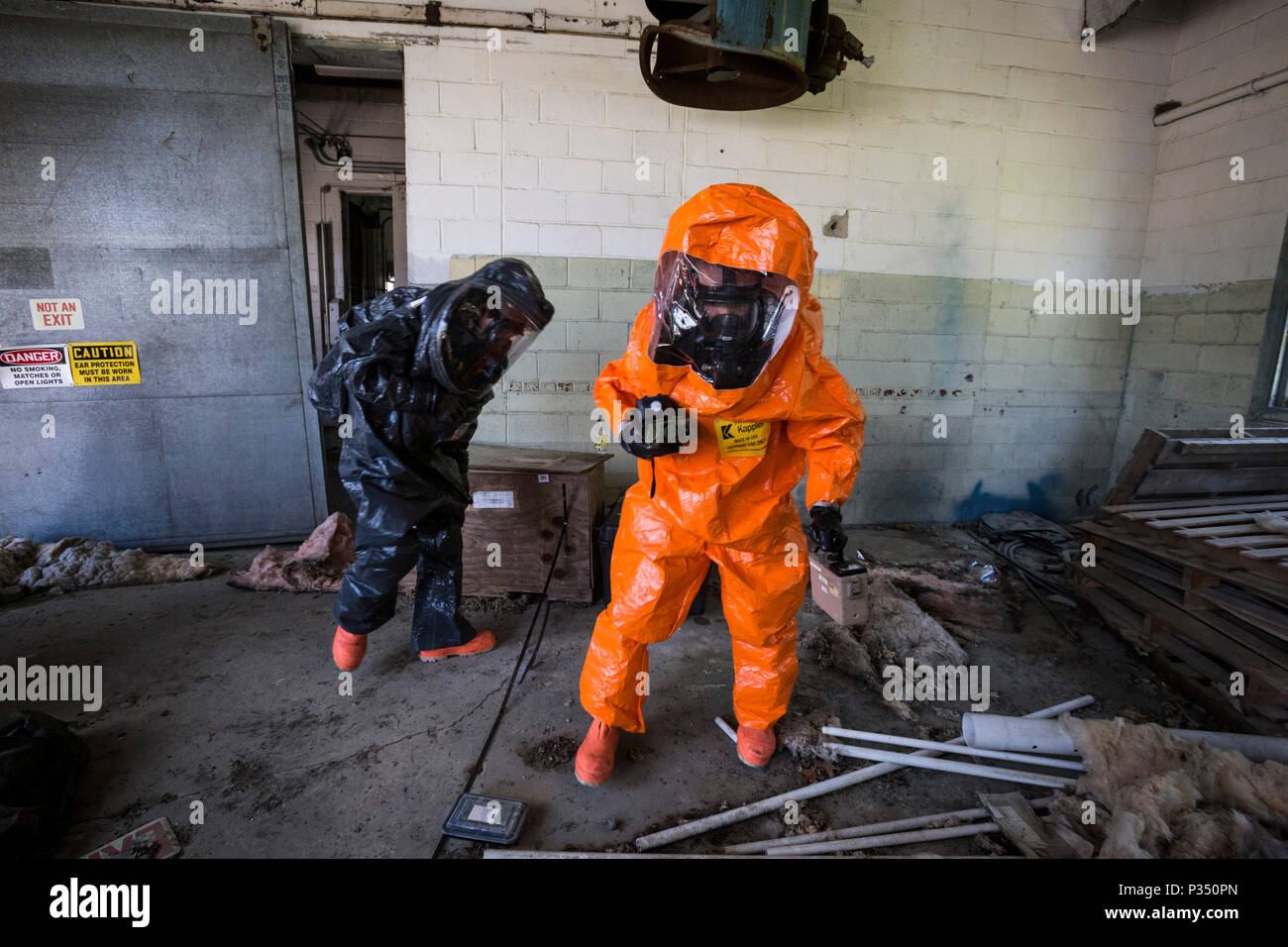 U.S. Army survey team chief Staff Sgt. Cory Sweetman, right, and survey