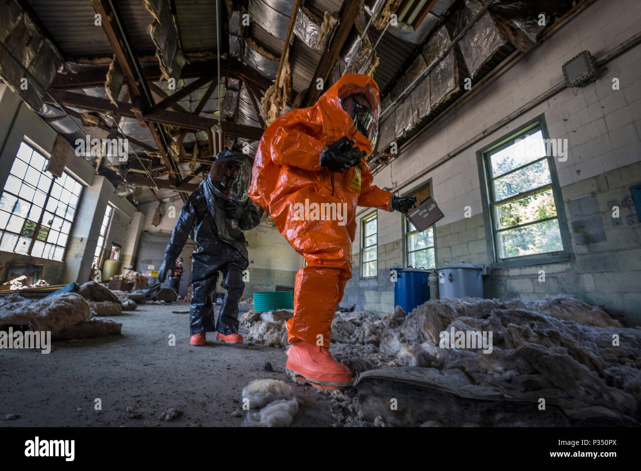 U.S. Army survey team chief Staff Sgt. Cory Sweetman, right, and survey