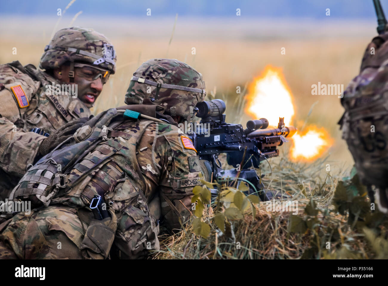 U.S. Army Soldiers with 1st Squadron, 2nd Cavalry Regiment, provide support by fire during a multinational training event for exercise Puma 2 with Battle Group Poland at Bemowo Piskie Training Area, Poland on June 14, 2018 as part of Saber Strike 18. This year's exercise, which runs from June 3-15, tests allies and partners from 19 countries on their ability work together to deter aggression in the region and improve each unit's ability to perform their designated mission. (U.S. Army photo by Spc. Hubert D. Delany III /22nd Mobile Public Affairs Detachment) Stock Photo