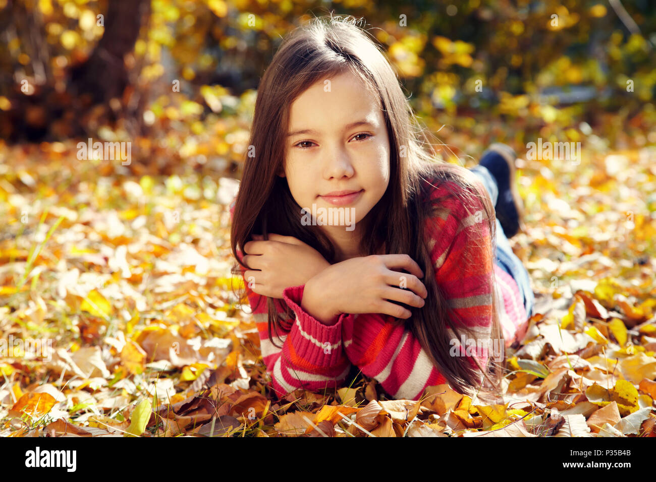 smiling teenage girl in autumn Stock Photo - Alamy