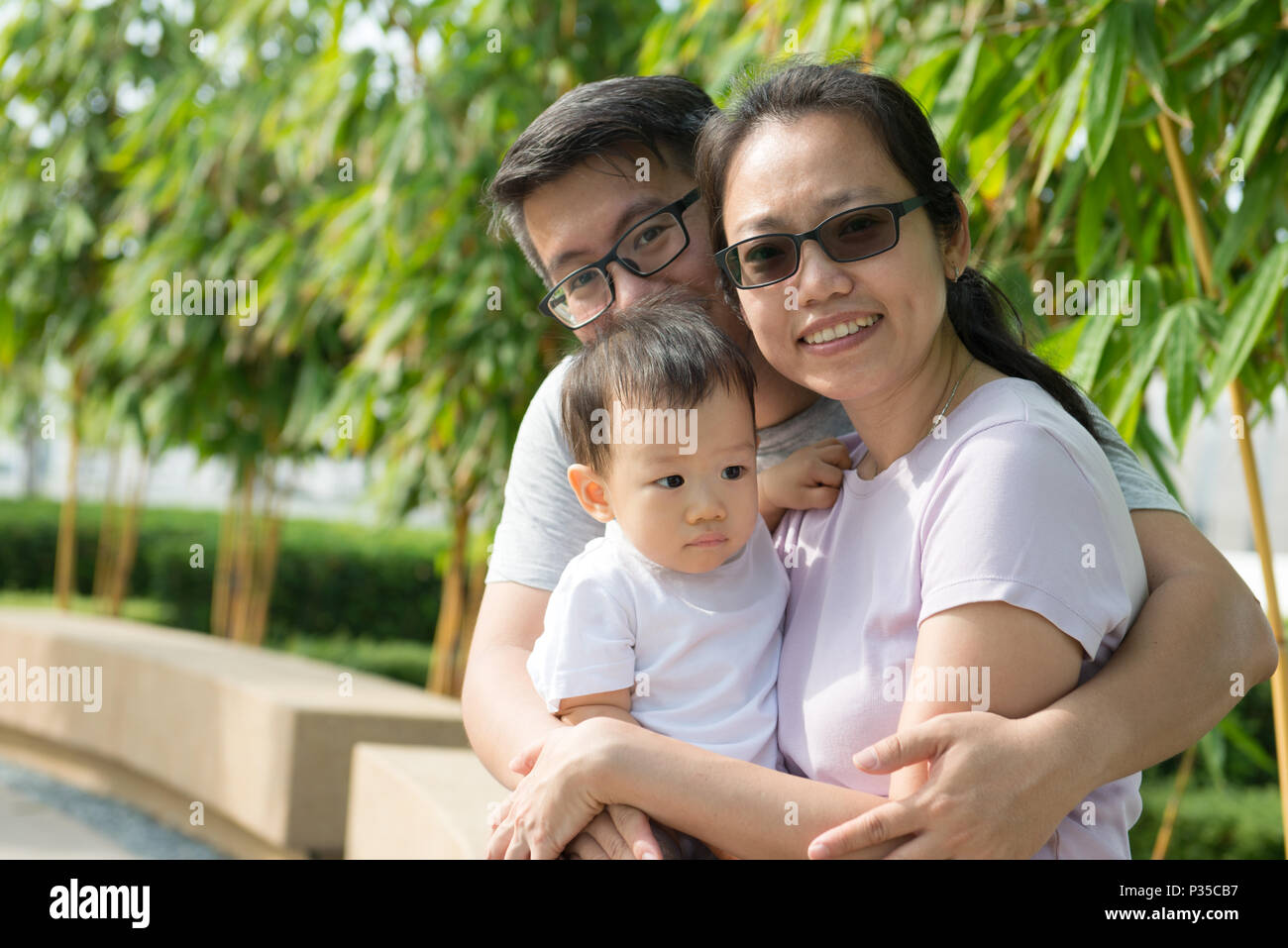 Young Asian Chinese family outdoor Stock Photo