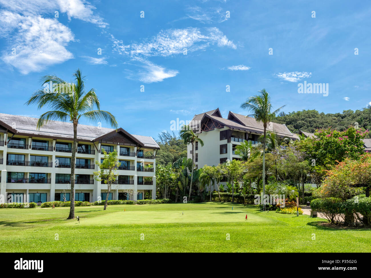 The Hotel buildings and croquet lawn at the Shangri La Rasa Ria Hotel and Resort in Kota Kinabalu, Borneo, Malaysia Stock Photo
