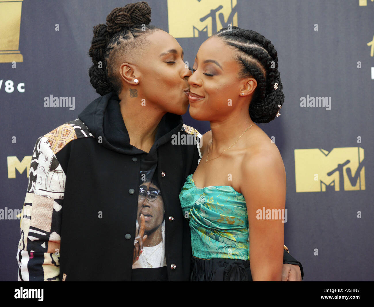 Lena Waithe, left, and her girlfriend, Alana Mayo attending the 2018 MTV Movie and TV Awards held at the Barker Hangar in Los Angeles, USA. Stock Photo