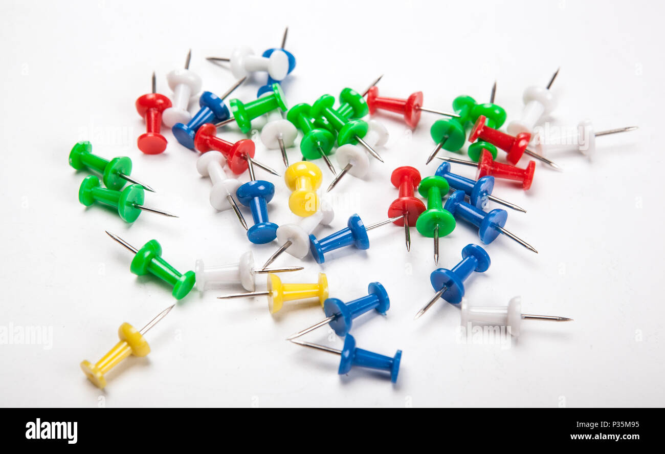 Set of push pins in different colors on a white background Stock Photo