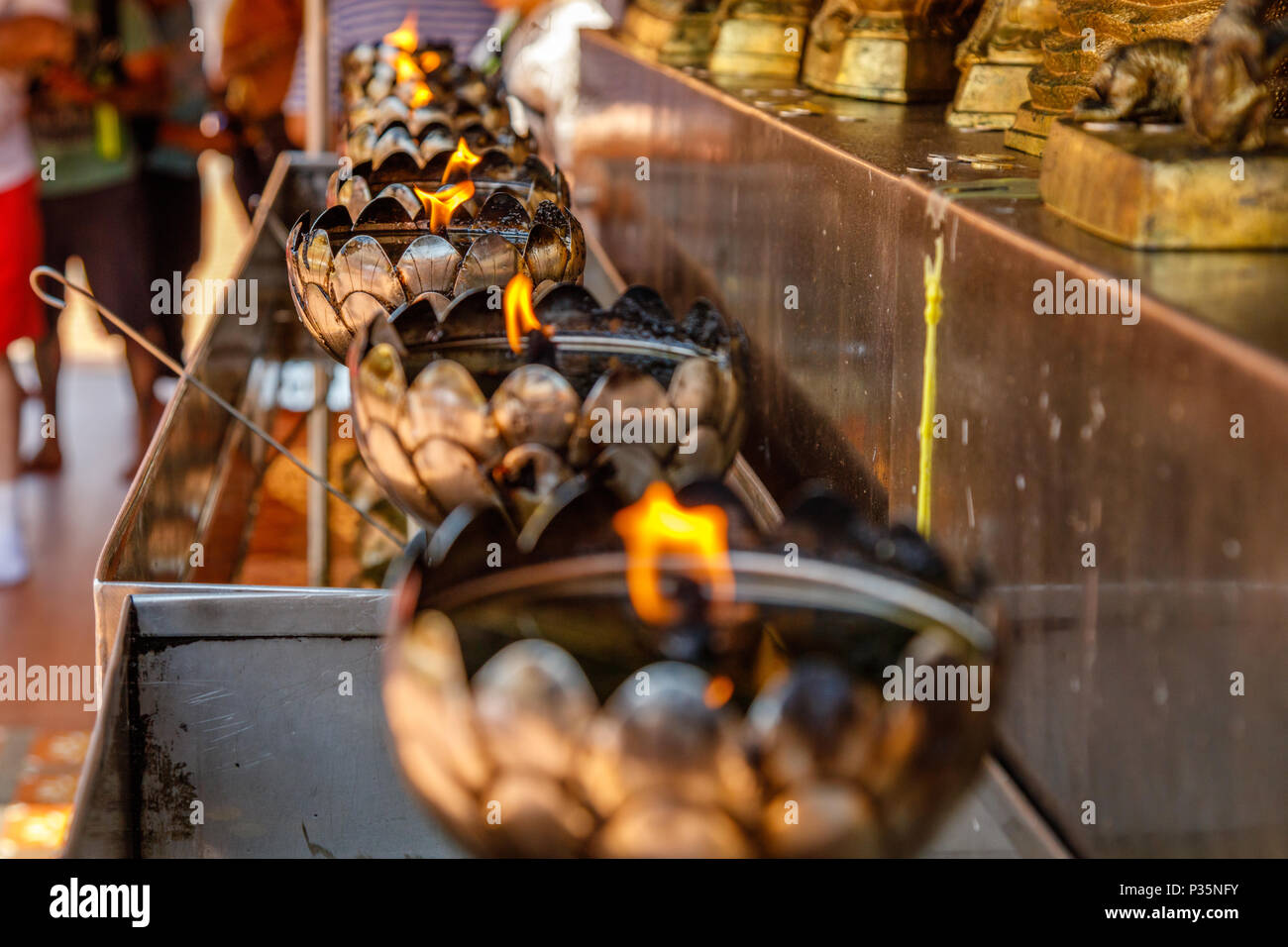 Oil burners at Wat Prathat Doi Suthep, Chiang Mai province, Thailand Stock Photo
