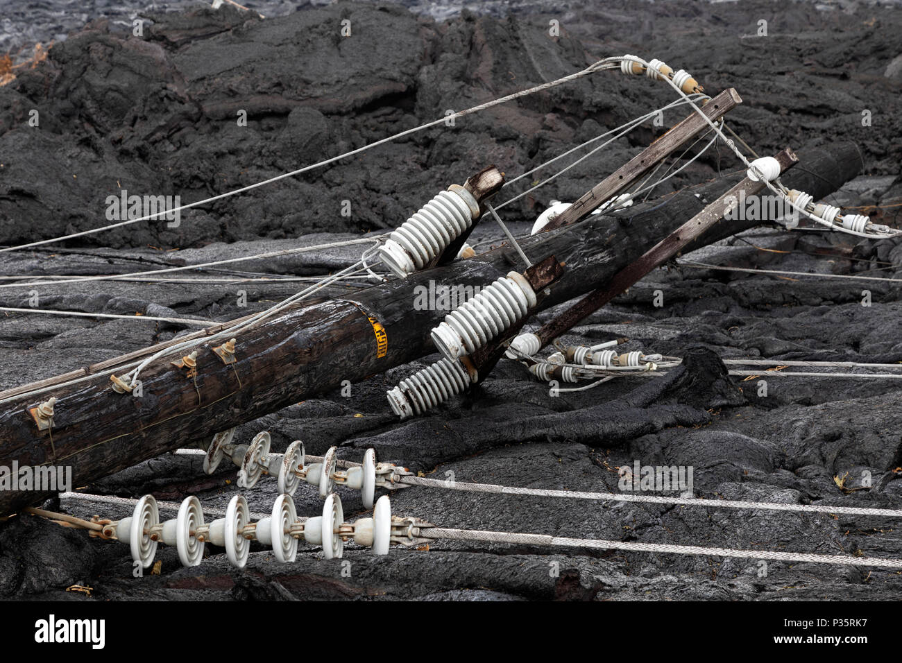 High voltage power line destroyed by a lava flow in Hawaii Stock Photo