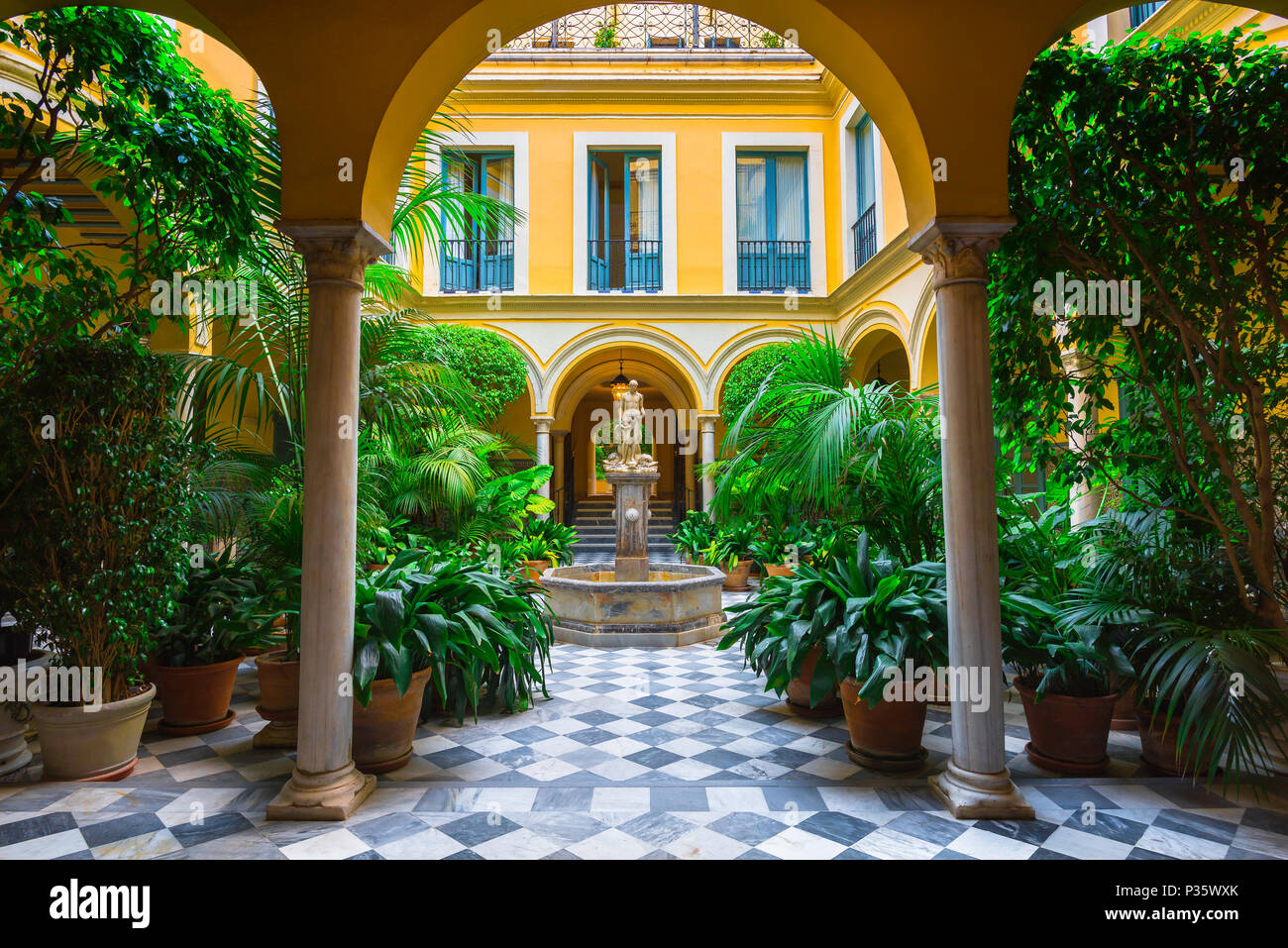 Andalucia Spain house, a typical Andalucian courtyard and patio (the Condes de Casa Galindo) in the old town quarter of Seville - Sevilla - Spain. Stock Photo