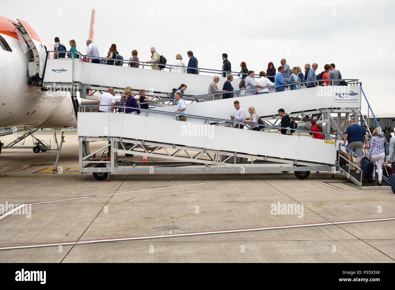 Bristol Airport, UK. Passengers board an Easyjet aircraft using an