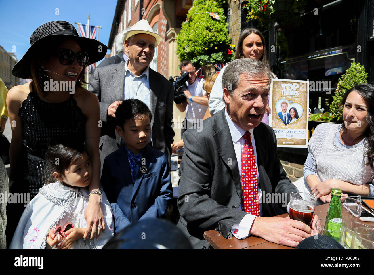 Nigel Farage meets Royal fans from UK and around the world in Windsor ahead of the wedding of Prince Harry and Meghan Markle on Saturday 19 May 2018.  Featuring: Nigel Farage, Christina Araneta-Tan, Lucas (7 yrs old), Sienna (5 yrs old) Where: Windsor, United Kingdom When: 17 May 2018 Credit: Dinendra Haria/WENN Stock Photo