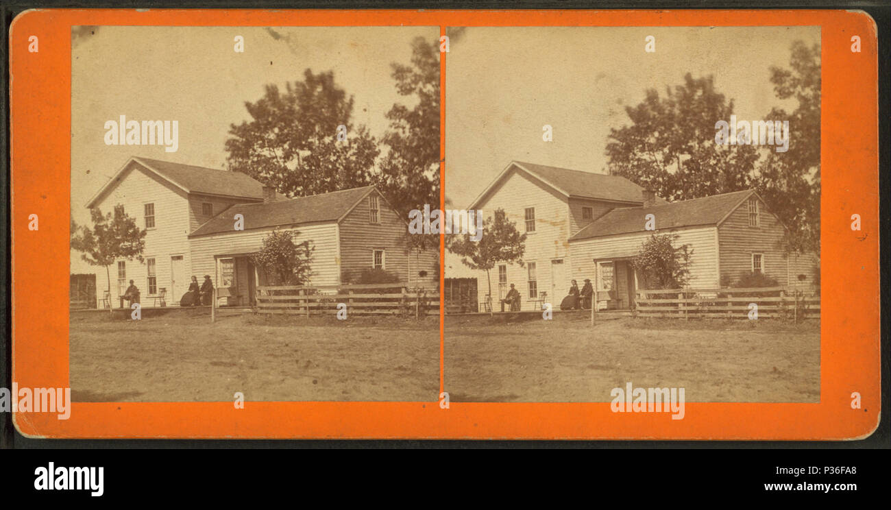 77 Couple sitting in front of their home, Waterloo, Iowa, by Hickox &amp; Co. Stock Photo