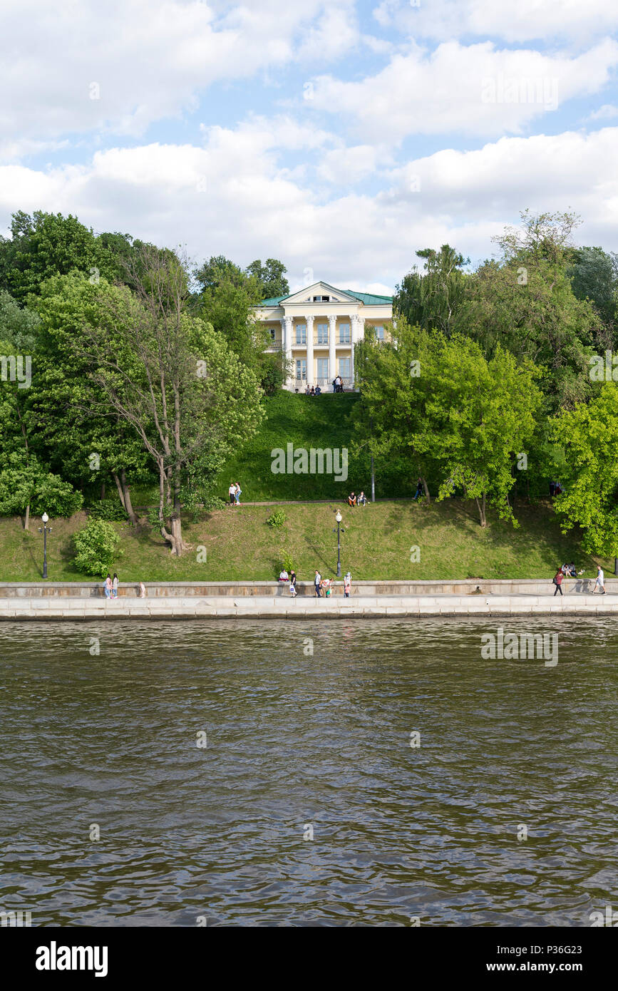 People walk along the embankment along the Moscow river on a Sunny ...