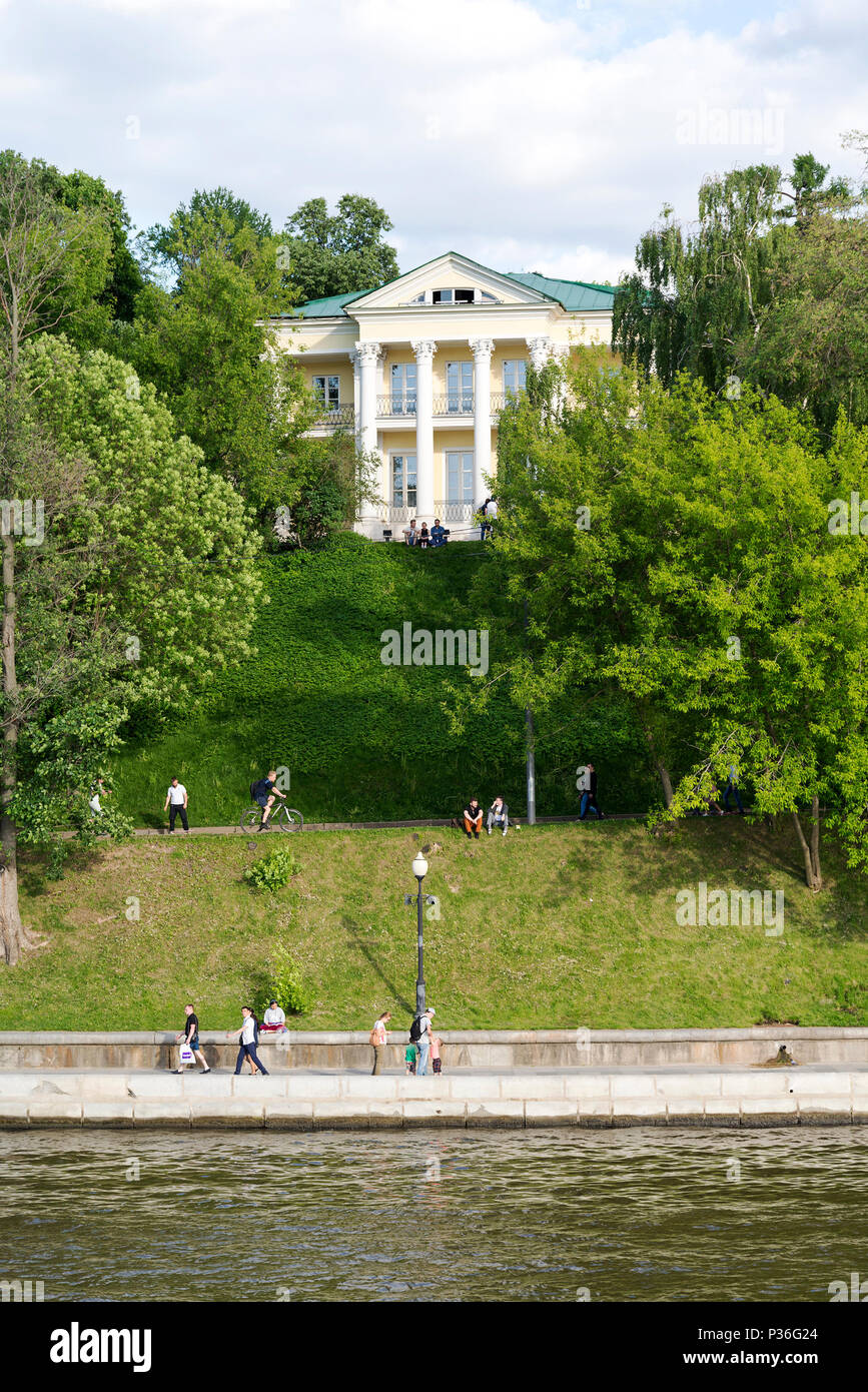 People walk along the embankment along the Moscow river on a Sunny ...