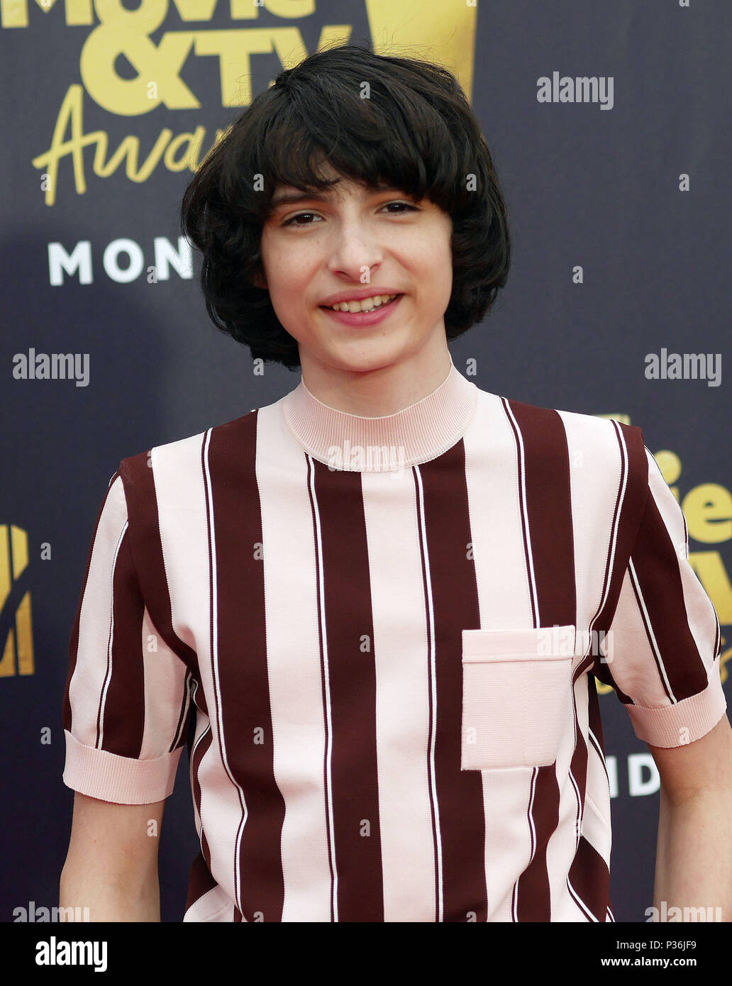 finn-wolfhard-attending-the-2018-mtv-movie-and-tv-awards-held-at-the