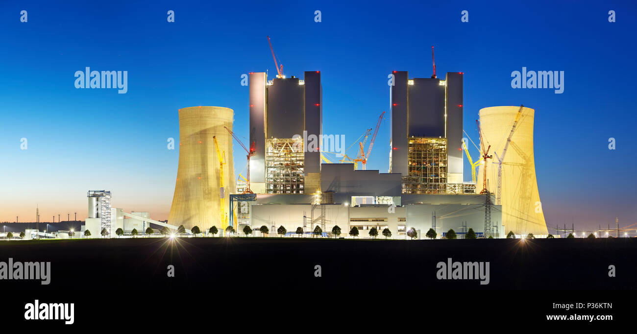 Panoramic view of a construction site of a new brown coal power plant at night. Stock Photo