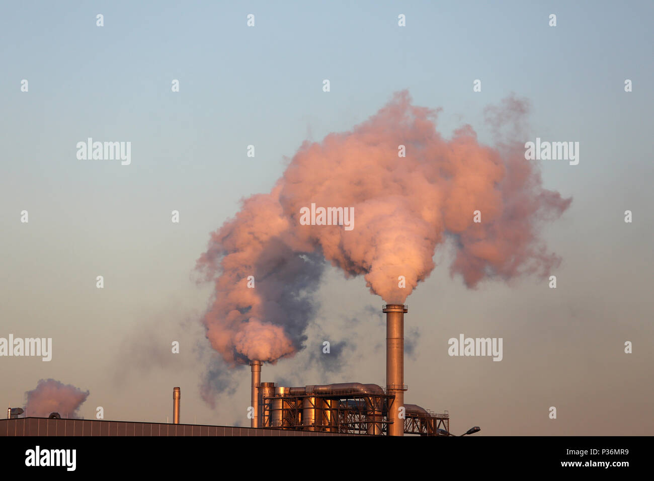 30.12.2016, Wismar, Mecklenburg-West Pomerania, Germany - Smoking chimneys of the industrial plant Klausner Nordic Timber. 00S161230D134CAROEX.JPG [MO Stock Photo