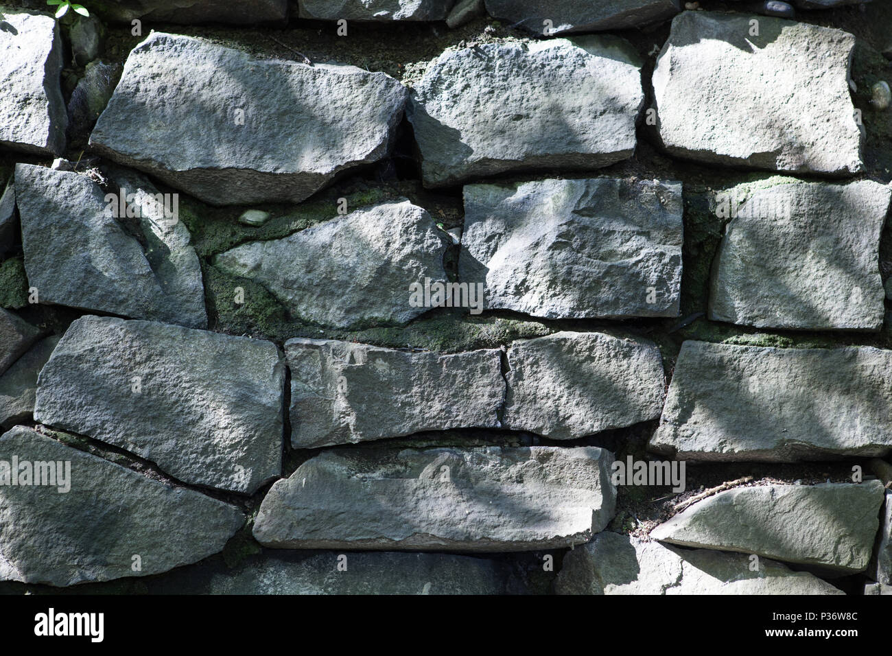Old granite stone wall close up Stock Photo