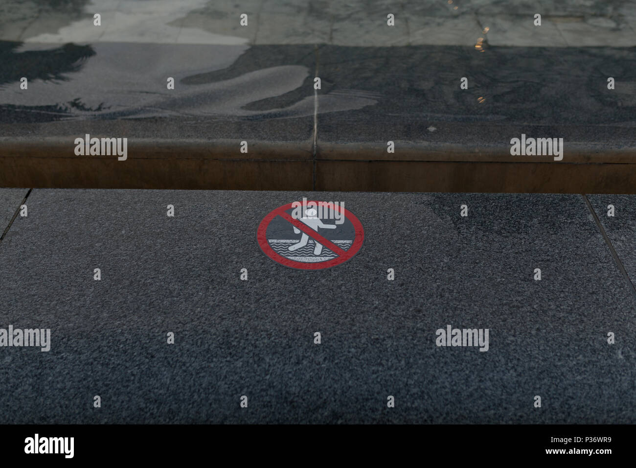 warning sign with pictogram, no swimming or wading. Water in the