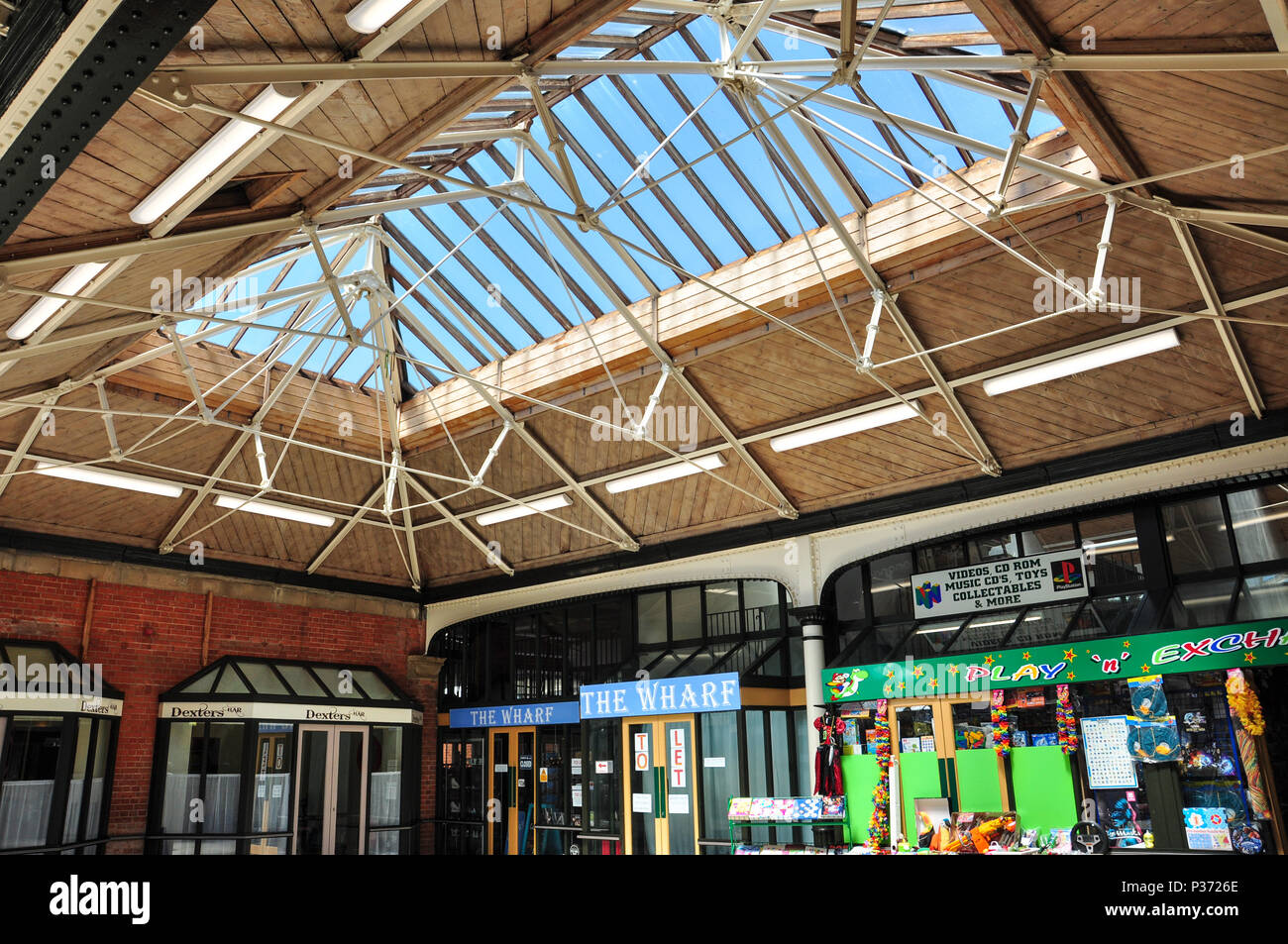 Former railway station booking hall; now a mini shopping centre, Felixstowe, Suffolk, England, UK Stock Photo