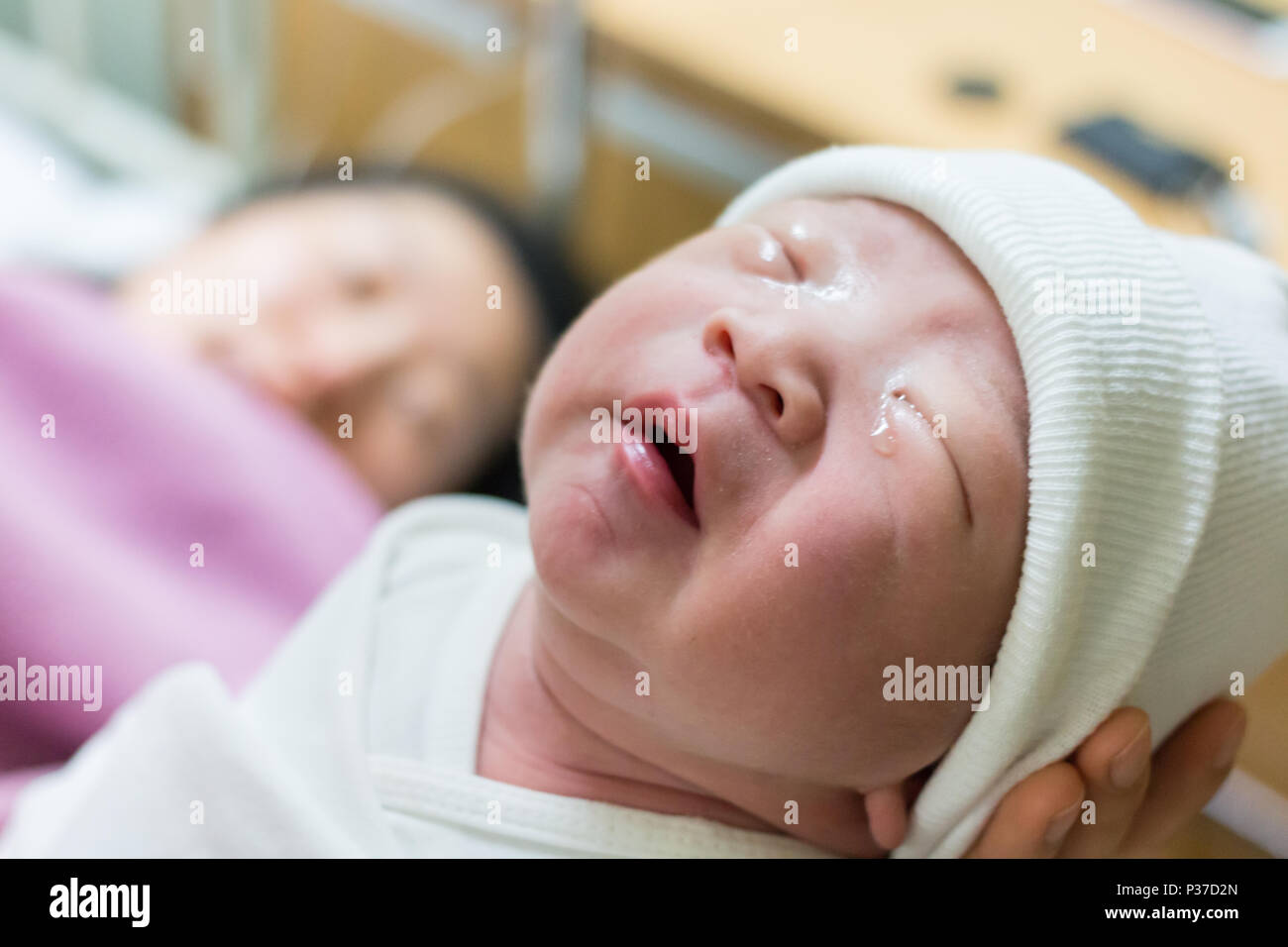 Mother giving birth to a baby. Female pregnant patient in a modern hospital. Stock Photo