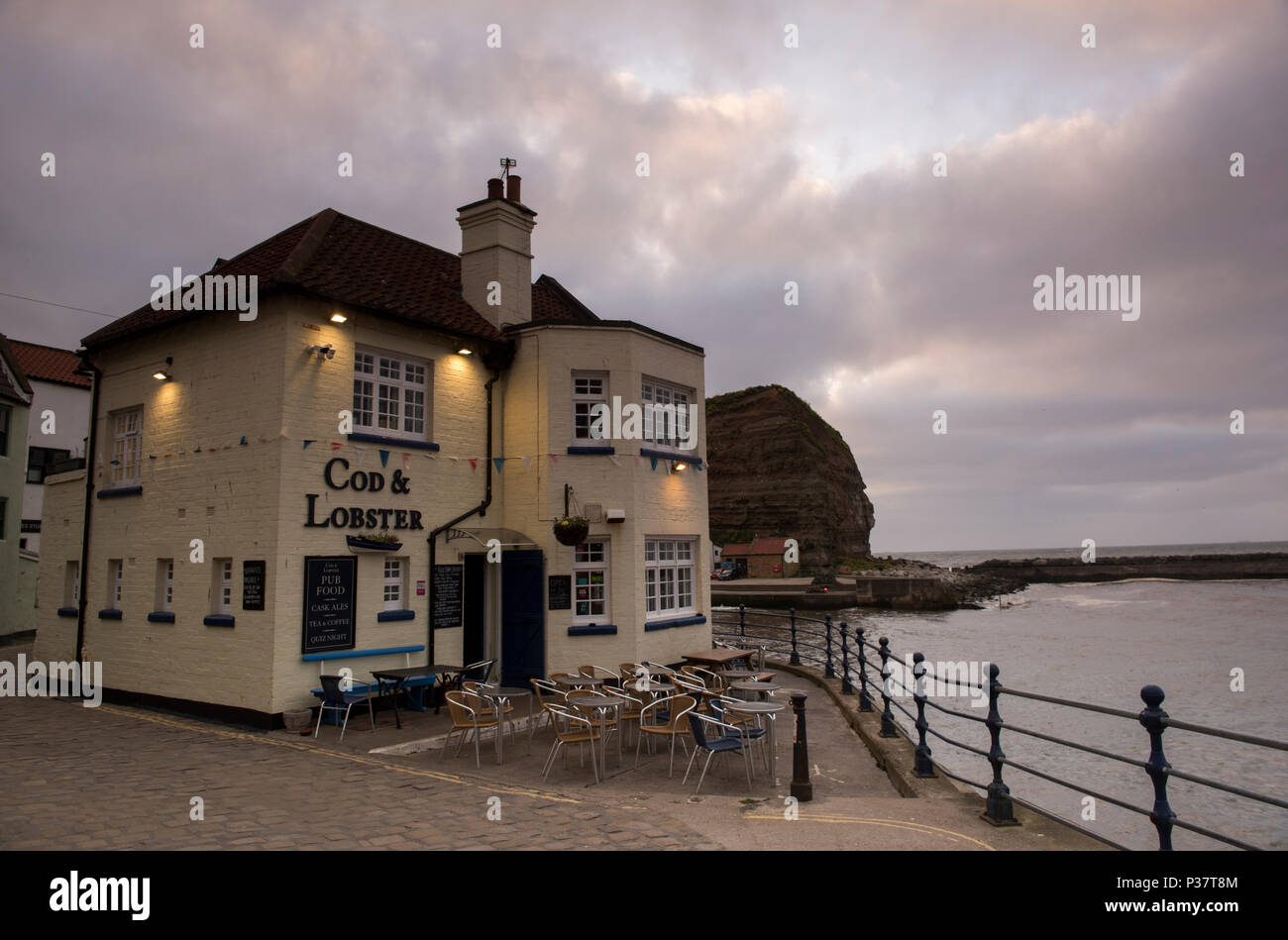 Sunset over the Cod and Lobster Pub in the village of Staithes, North