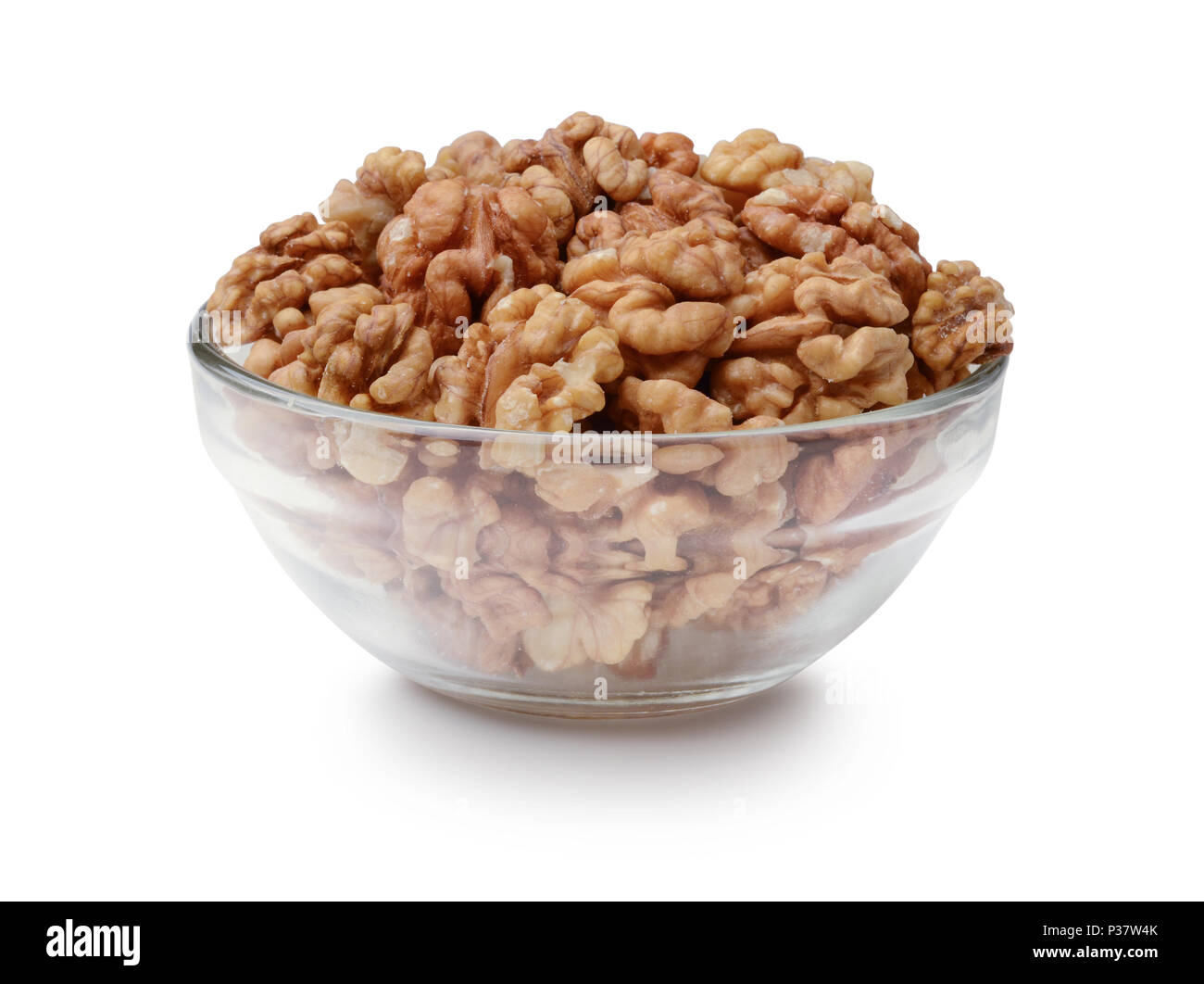Walnuts in a glass bowl isolated on a white background Stock Photo