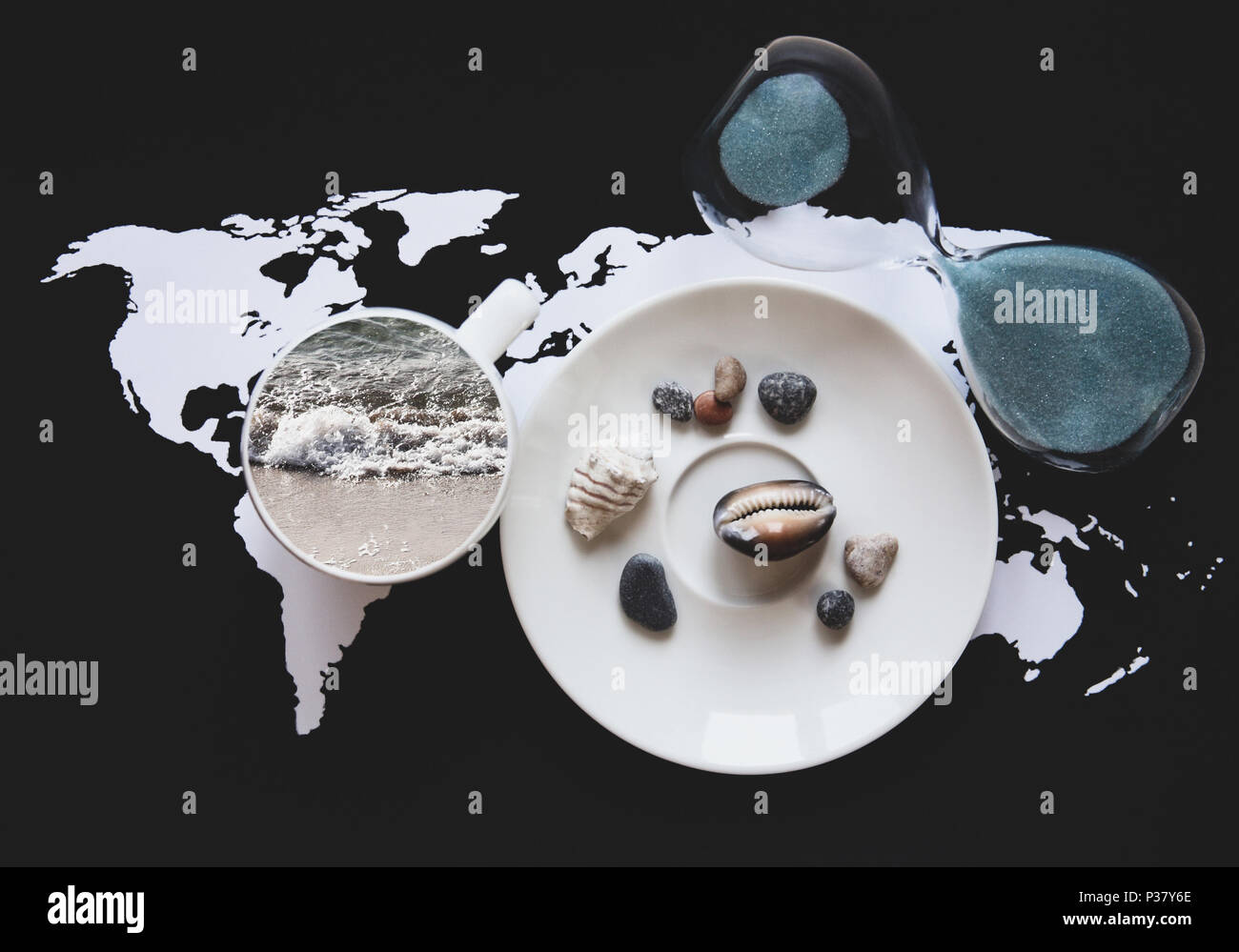 Collage in retro style, planning vacation/ world map, sandglass, cup with the sea inside and saucer with shells Stock Photo