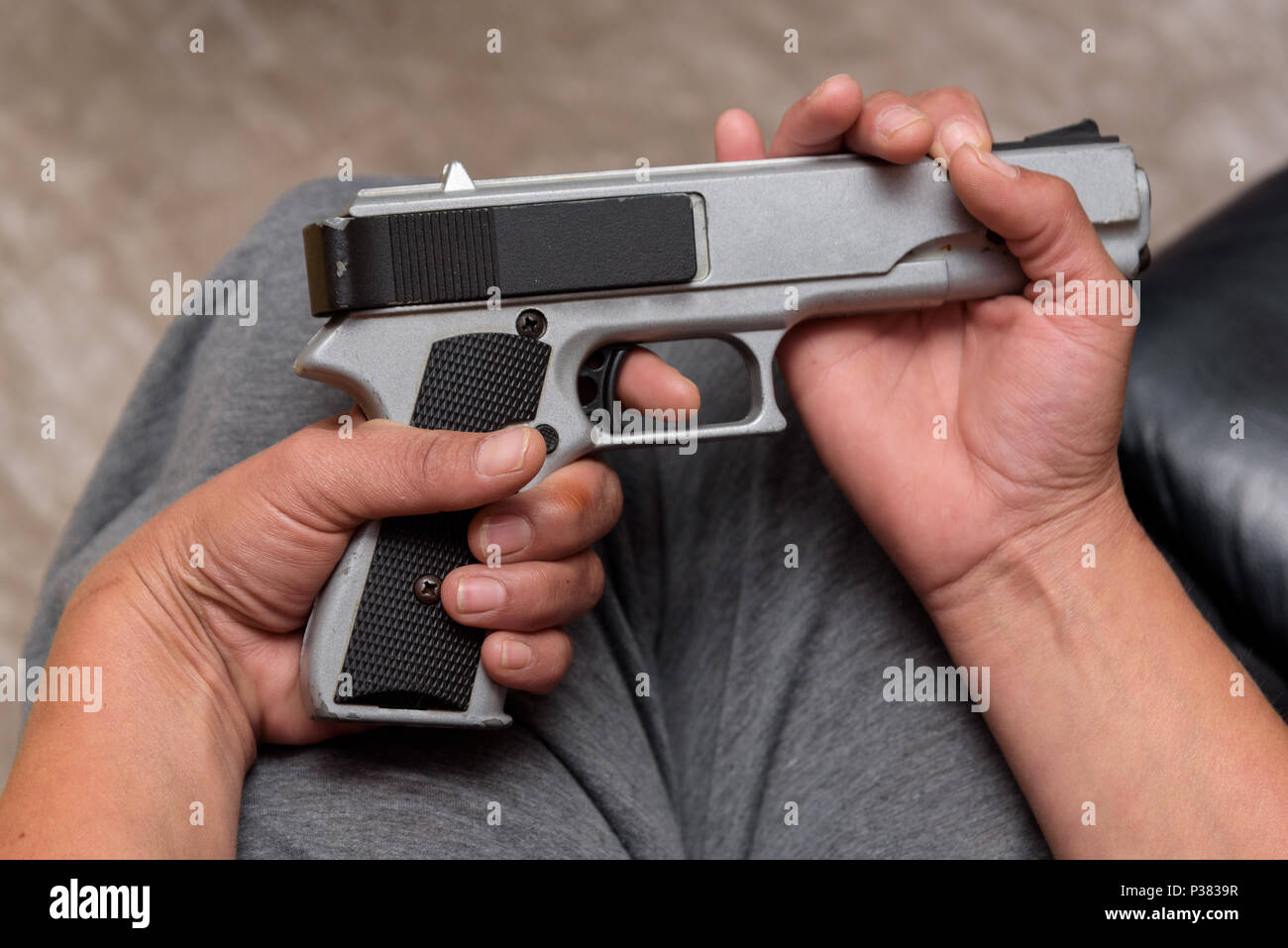 Woman holding gun her hand hires stock photography and images Alamy