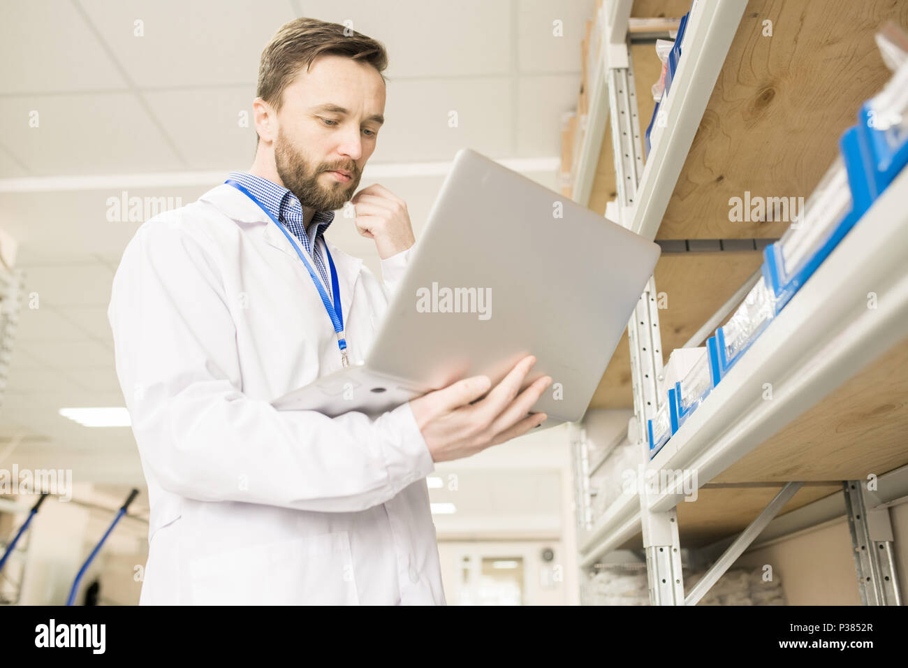 Bearded Engineer Using Laptop Stock Photo