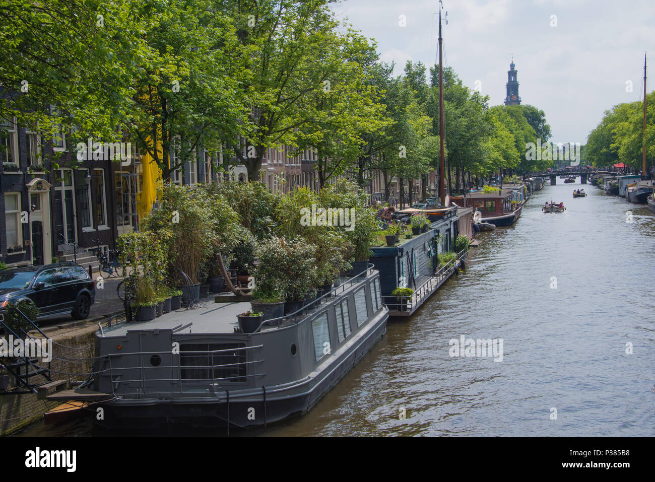 Houseboats on a Dutch Canal in Amsterdam in the Nine Streets district Stock Photo
