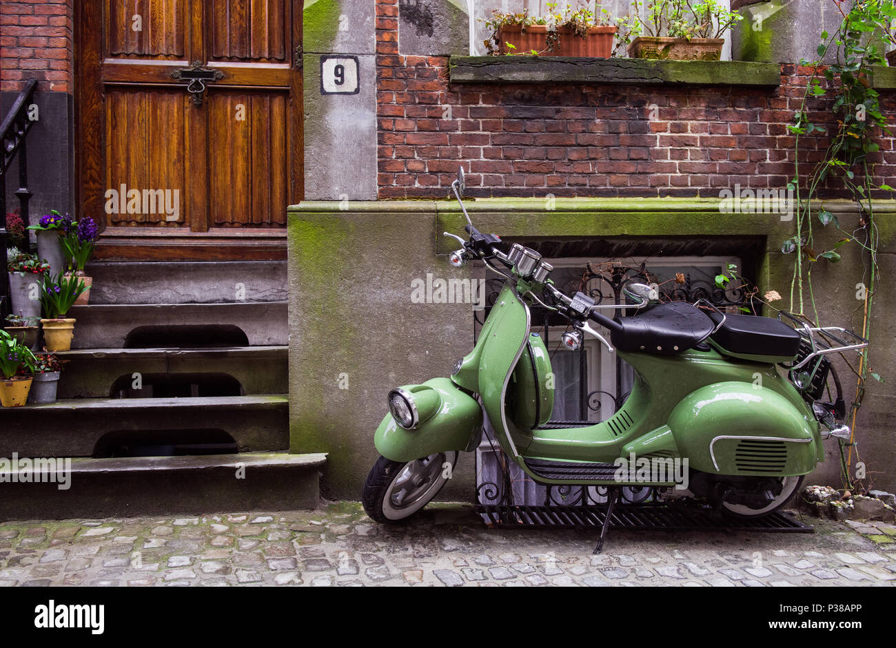 just take a picture of this beautifull green scooter fit with the  background...love to watch Stock Photo - Alamy