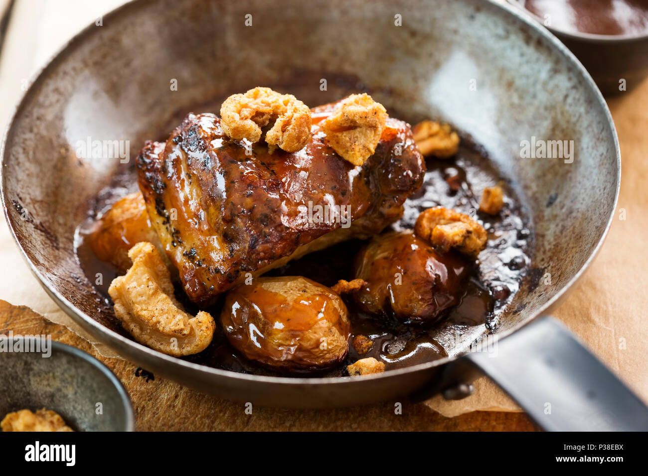 Slow cooked pork belly with crackling and pork jus & baby potatoes
