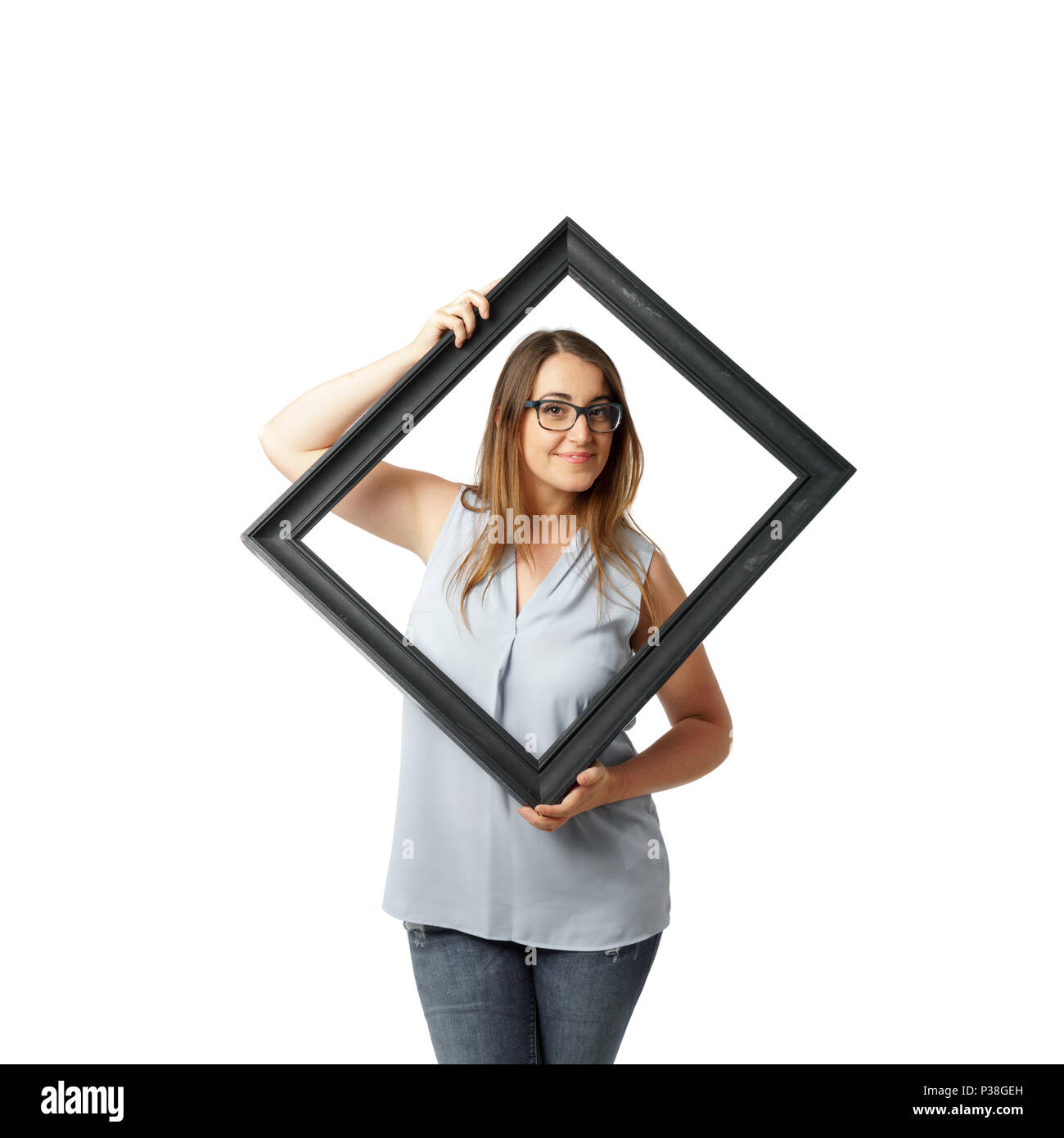 Woman with glasses behind crooked black frame Stock Photo Alamy