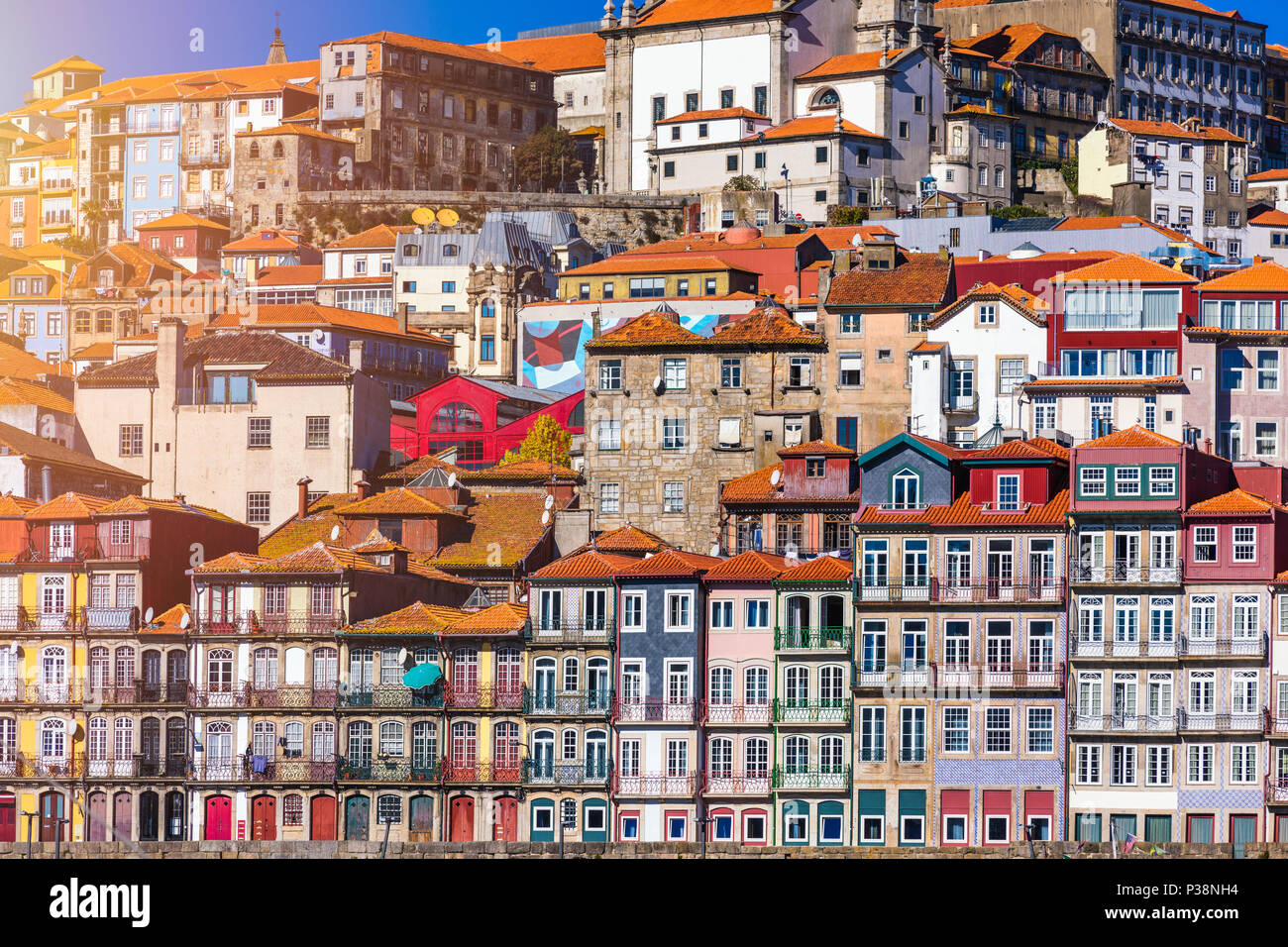 Colorful houses of Porto Ribeira, traditional facades, old multi-colored  houses with red roof tiles on the embankment in the city of Porto, Portugal  Stock Photo - Alamy