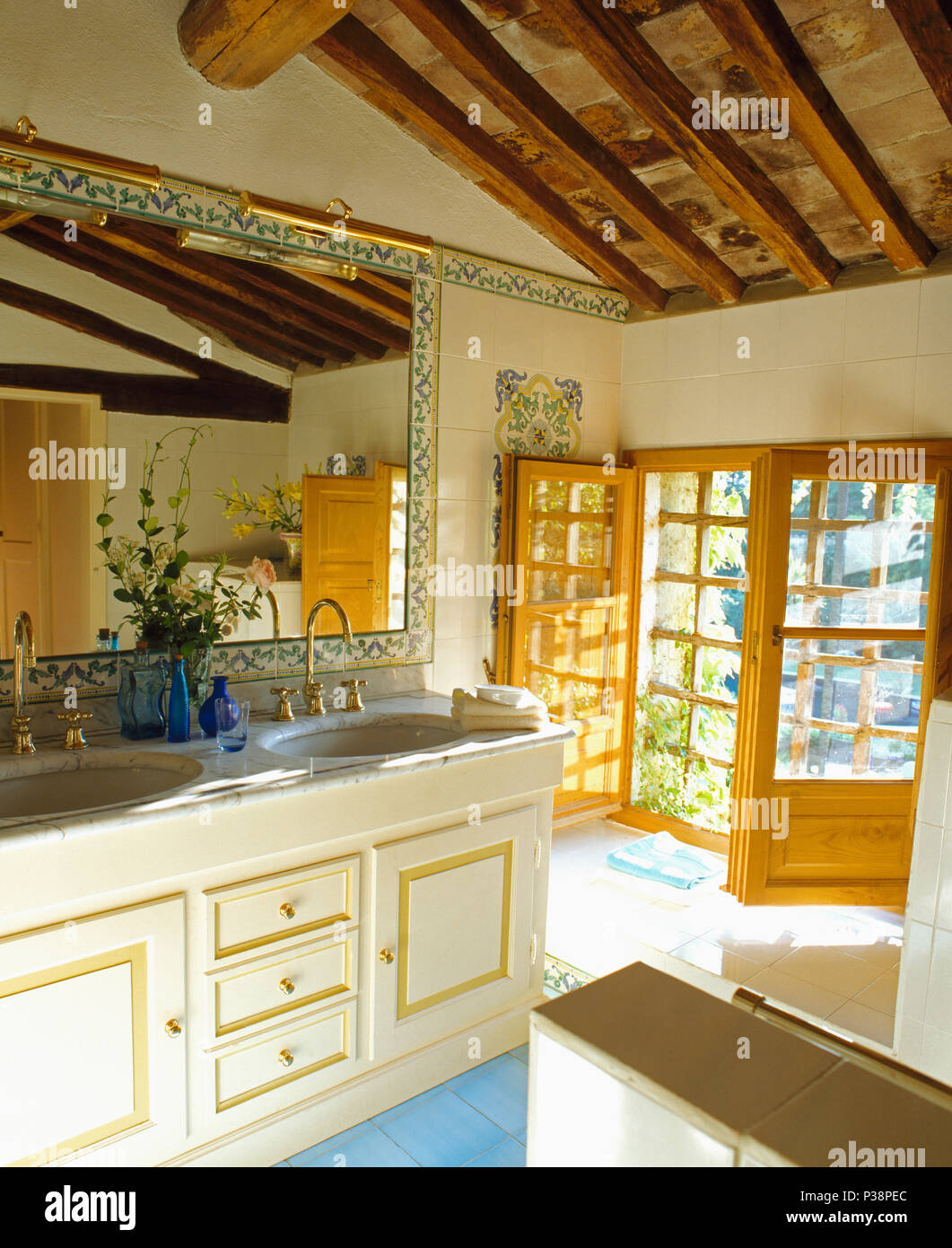 Tile Framed Mirror Above Double Basins In Vanity Unit In Sunny Tuscan Bathroom With French Windows Stock Photo Alamy Tile Framed Mirror Above Double Basins In Vanity Unit In Sunny Tuscan Bathroom With French Windows Stock Photo Alamy